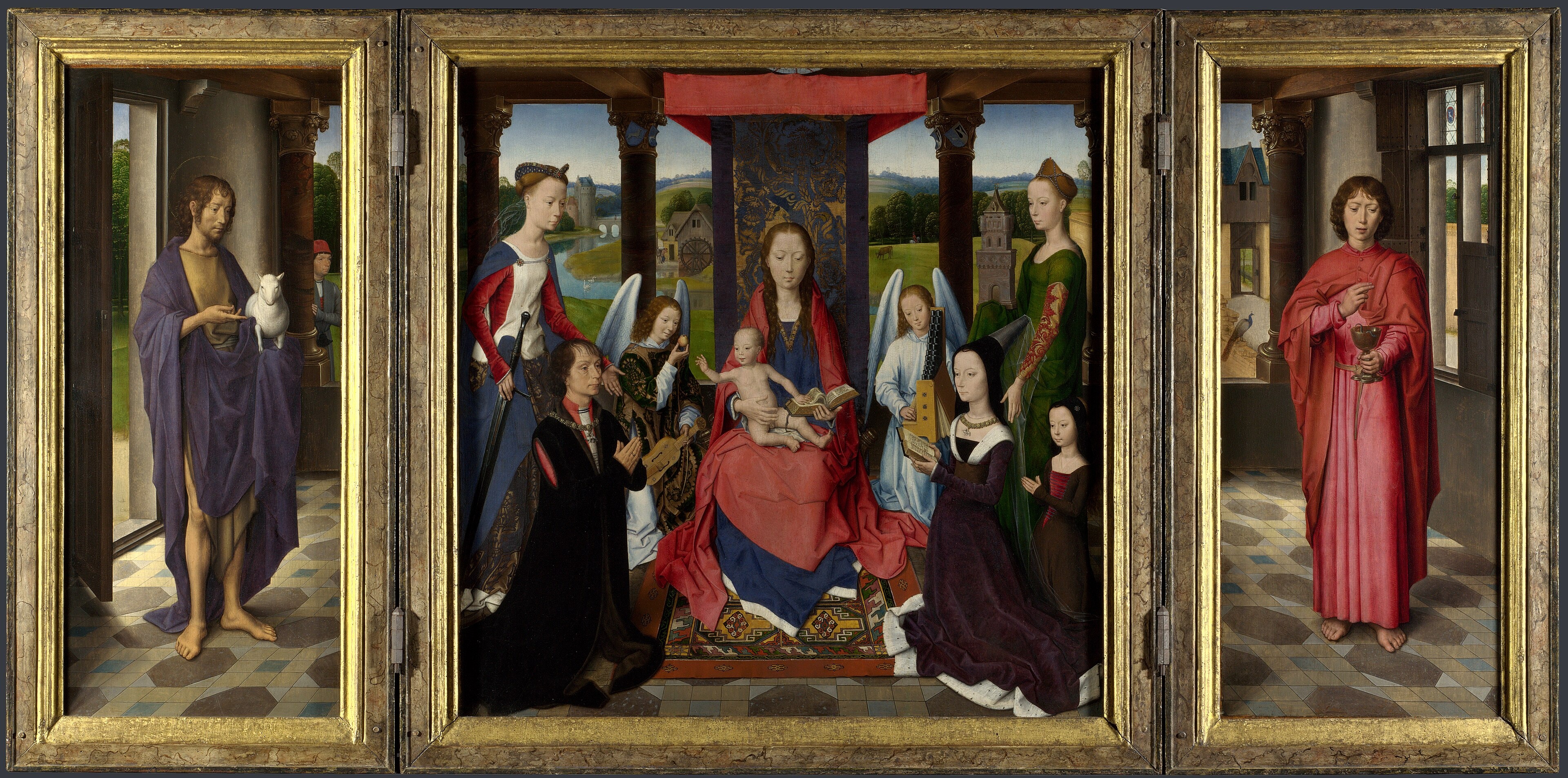 The Virgin and Child with Saints Catherine and Barbara, and John Donne of Kidwelly and his family by Hans Memling