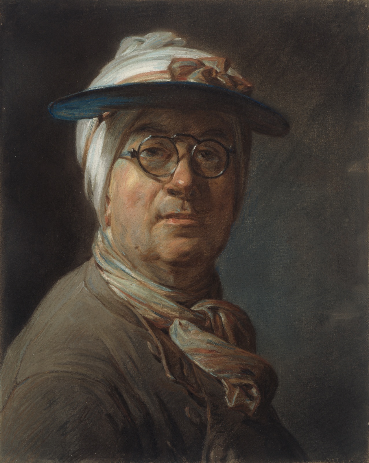 Portrait of a man wearing glasses, pink and white scarf, and blue visor.