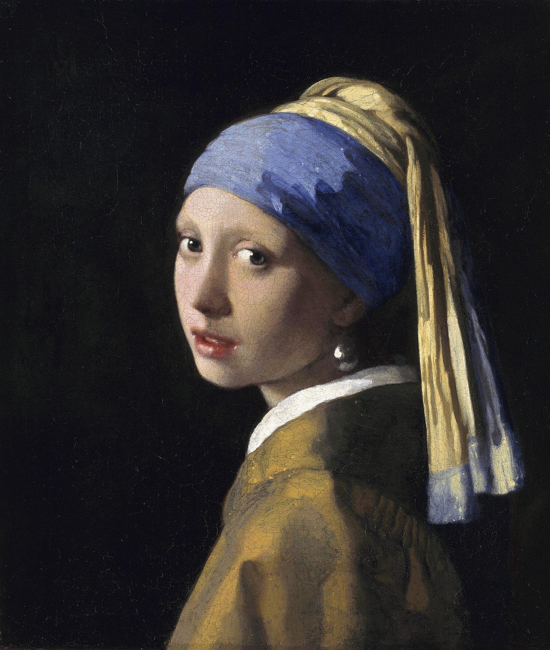 Vermeer: a girl turning toward the viewer in a blue-and-yellow head covering with a bright pearl earring.