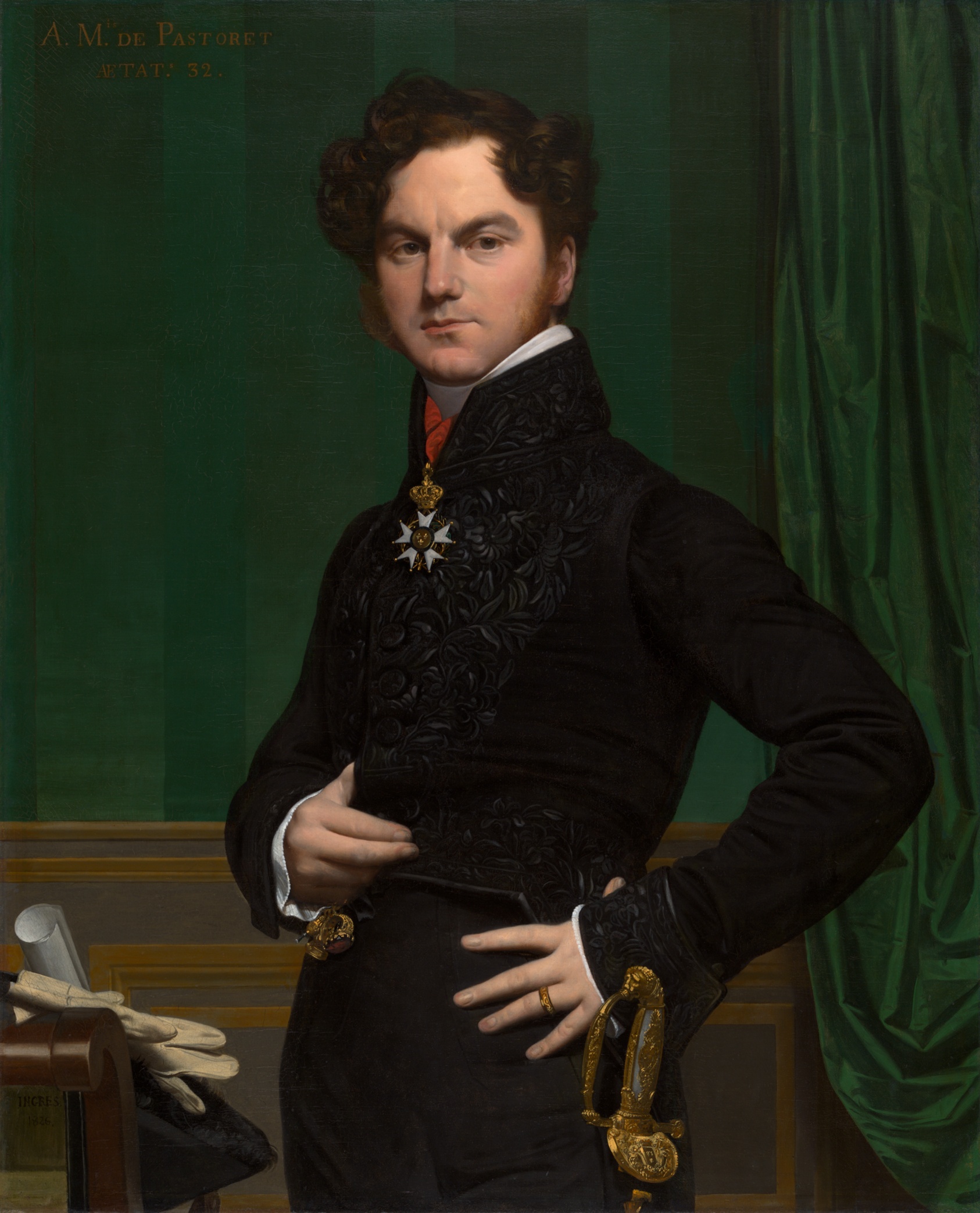 Portrait of white man dressed in all black with medallion and sword.