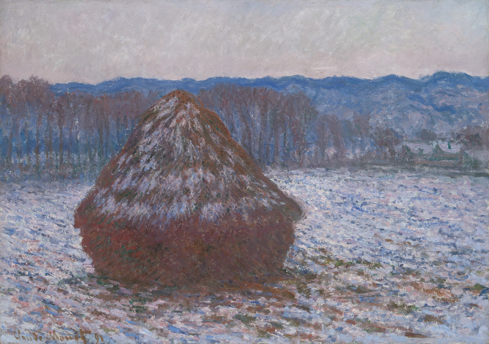 A snowy landscape in cool tones featuring a prominent, snow-dusted haystack in reddish brown in front of a row of red-brown trees and low, blue mountains, all beheath a pink-gray strip of sky.