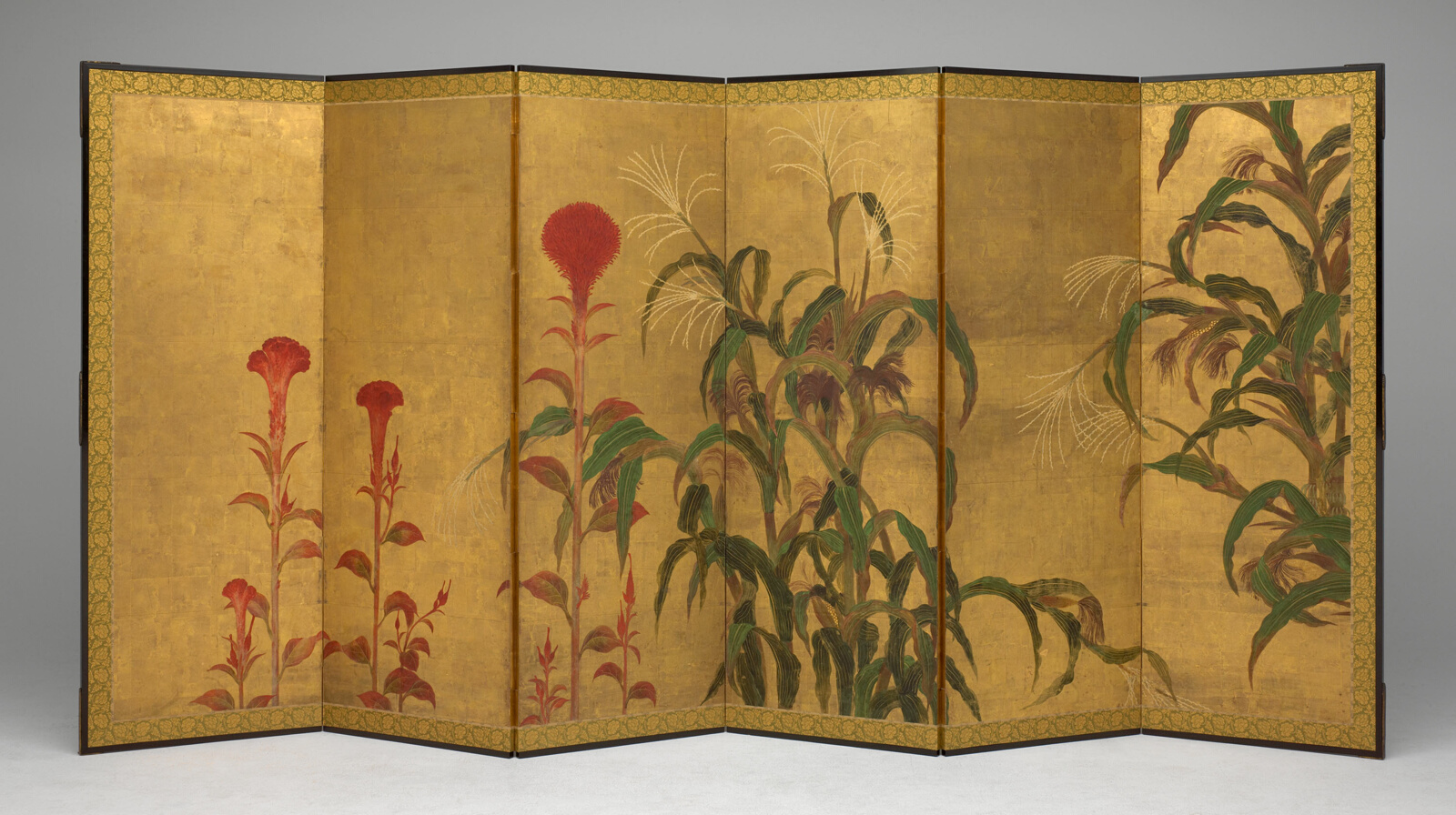 Gold folded tall screen with red flowers, green maize plants.