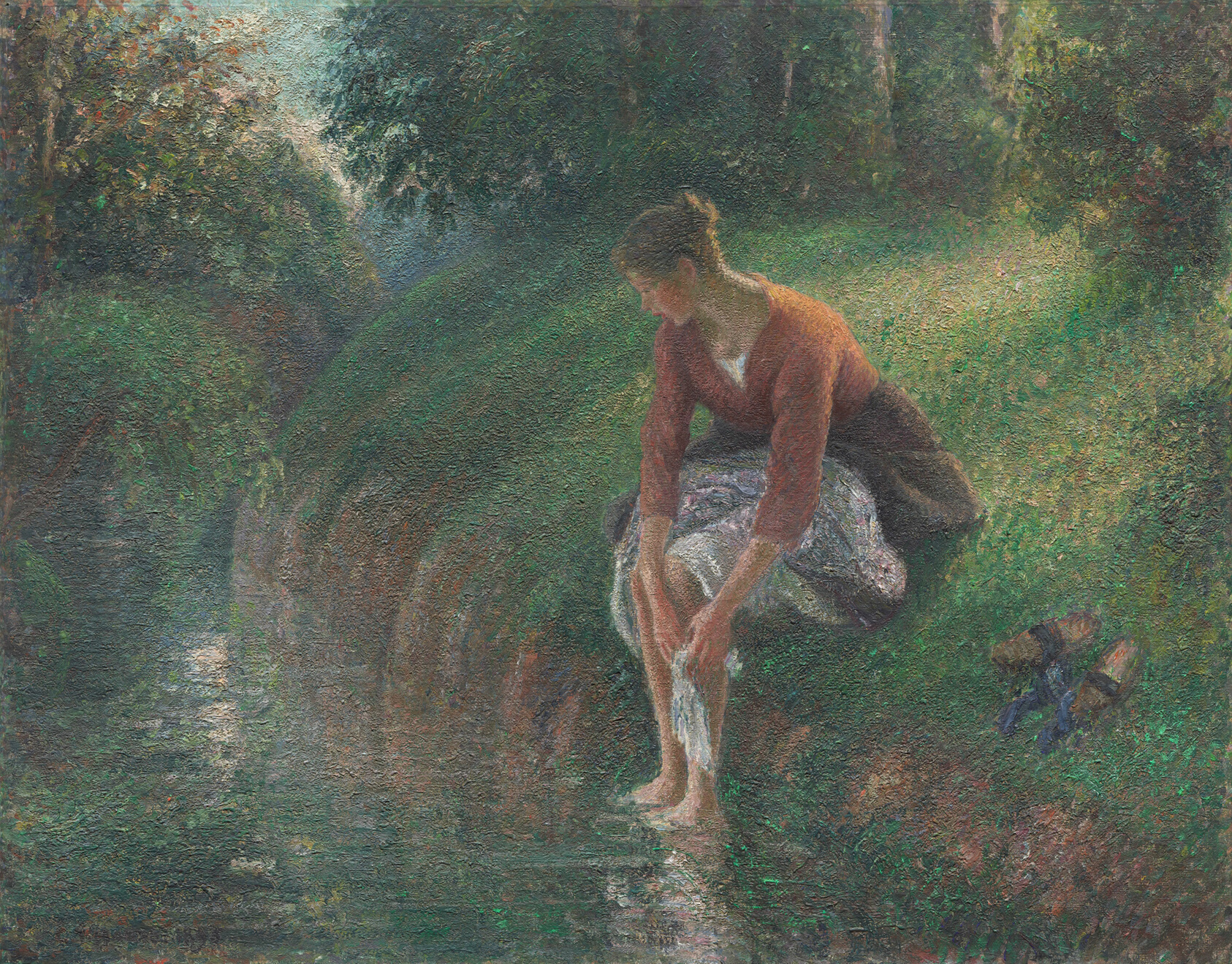 Small dots of soft color form a woman in a red shirt and brown skirt seen up close, washing her bare feet in a lush brook while seated on a sloping bank.