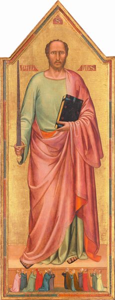 Against a shiny gold background, a man with peach-colored skin nearly fills this tall, narrow, vertical panel above a row of twelve people, significantly smaller in scale, kneeling by his feet and looking up at the man, their hands together in prayer. The top of the panel comes to a point above the man’s head. His body faces us, and he looks at us with brown eyes under furrowed, dark eyebrows. His nose is long and straight, and his mouth is small with a rosy lower lip. He has a brown, trimmed beard, and his hair is receding. He holds up a gold-handled sword with a slate-gray blade in his right hand, on our left, while in his other hand, he cradles a thick black book with a gold-edged pages against his chest. The man wears a floor-length, celery-green tunic with a flowing, rose-pink robe over his left shoulder, on our right, and around his body. The robe is lined with tangerine orange and has a faint, patterned border. The toes of his sandaled feet stick out. On a smaller scale, along the bottom of the painting, six pairs of people kneel facing the center, three couples to each side. Eleven of the people gaze with heads tipped back, up at the man with their hands folded in prayer. To our right, one woman turns and gestures, mouth open, to her neighbor. Their long robes are painted in shades of shell pink, indigo blue, scarlet red, butter yellow, sage green, and chestnut brown. Some wear white fabric over their hair while others are bareheaded. The gold background is incised around the man’s head to create a halo. Molding and a band of alternating strips of slate blue and brick red enclose the pointed panel. Three shapes, like small banners, are painted in red with gold lettering around the man’s head, with an “S” at the top center, “PAU” over his shoulder to our left, and “LUS” to our right. In the blue and red band set into the frame at the lower center, an inscription reads, “NI.MCCCXXXIII M II.ESPLETUM FUIT HC OPUS.” There is a noticeable network of cracks across the painting’s surface, especially on the gold background behind the man.