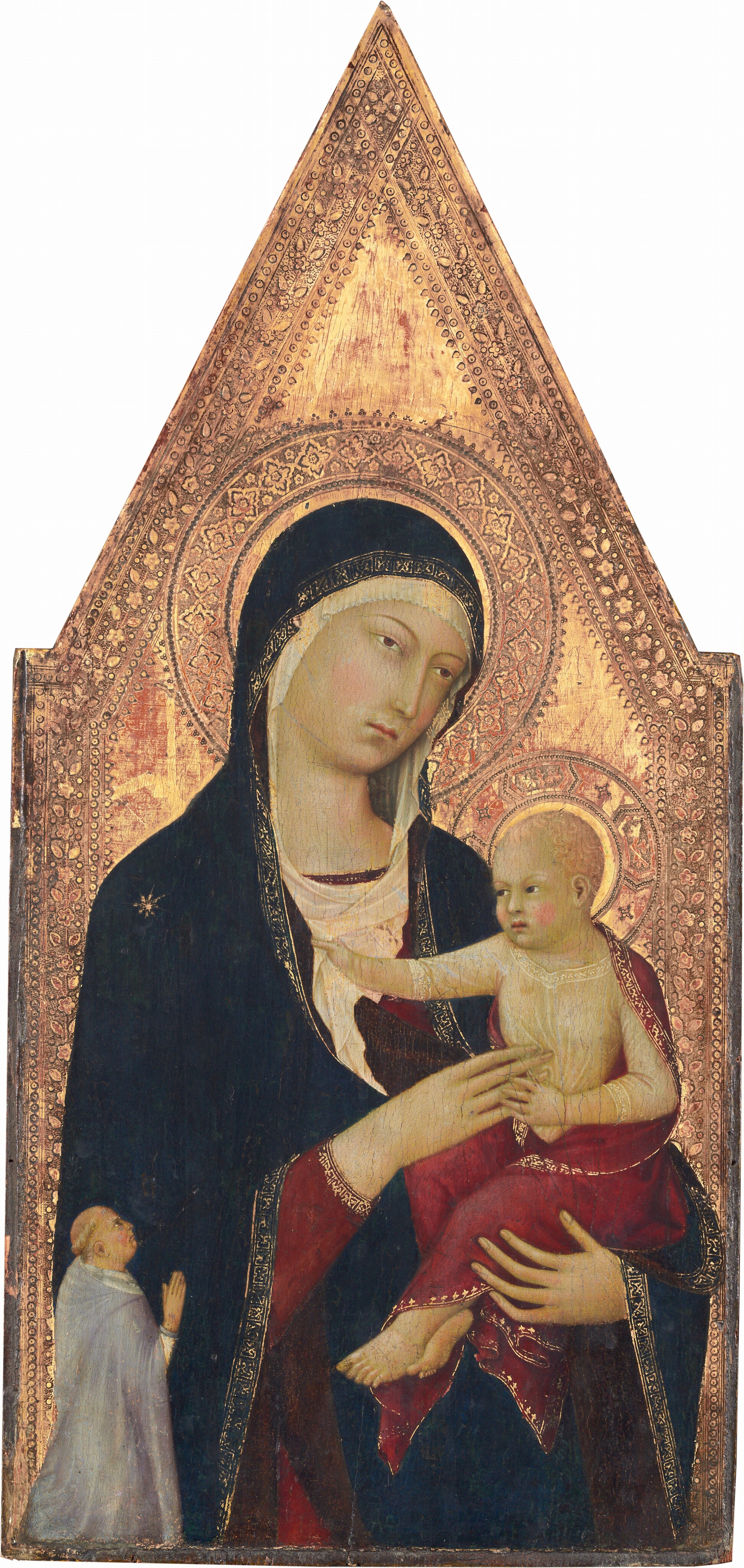 Shown from the hips up, a young woman holds an upright baby against a richly patterned gold background in this vertical panel painting, which comes to a point at the top center. The woman nearly fills the panel, and she looms over a very small man kneeling in the lower left, facing our right in profile. The people all have ivory-white skin with a greenish cast, and petal-pink cheeks. The woman’s body faces us, supporting the baby in the curve of her left arm, our right. Thin, tawny-brown eyebrows arch over her hazel, almond-shaped eyes, which gaze off to our right. She has a long, narrow nose and small rose-pink mouth. Her head tilts to our right and is covered by an ivory-white cloth that frames her round face and wraps around the neckline of her burgundy-red gown. Over the white cloth and red dress, a long, midnight-blue mantle trimmed with gold covers her head, shoulders, and arms. A gold starburst adorns one shoulder. Tucked in the woman’s elbow to our right, the baby faces our left and wears a sheer garment covered by a burgundy-red, gold-edged cloth draped across his shoulders, back, and legs. The child has short, wavy, peach-colored hair and echos the woman’s thin eyebrows and hazel eyes. He reaches out with his right hand, to our left, to clutch her scarf while his other hand delicately touches the fingers of her hand, which brushes his chest. The man in the lower left is significantly smaller in scale so his kneeling body comes only up to the woman's elbow. His blond hair is cut in a ring above the ears, and he wears a dove-gray cloak with a long hood falling back over his shoulders. His right hand is raised, fingers extended, and he tilts his head up to look at the woman. Intricate, patterned halos surrounding the heads of the woman and child are punched and incised into the gold background. A decorative border of flowers, leaves, and dots line the sides of the panel and meet at the pointed top. Areas of brick red show through some areas of the gold background.