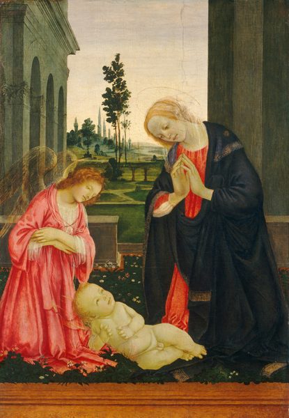 A winged angel, a woman, and a baby are gathered on a terrace that overlooks a softly lit landscape in this vertical painting. The people all have parchment-white skin tinged faintly with green, delicate gold halos, and they are close to us. The baby is round and plump, and faces us as he lies on his side on a carpet of pine-green grass dotted with small white and pink flowers. A band of caramel brown spans the lower edge of the painting. Propped up on one elbow, the baby turns his blond head to look at the woman kneeling beside him to our right. The woman, Mary, towers over the baby with her body angled slightly to our left. A midnight-blue cloak trimmed in gold is wrapped around her coral-red gown. The fingertips of her raised hands lightly touch as she bows her head and lowers her brown eyes to look at the child. A transparent white veil drapes over her blond hair. To our left, the angel also kneels and looks down at the baby with arms crossed over the chest. The angel has curly, copper-red hair and wears a carnation-pink robe over a transparent chemise. Semi-transparent, bronze-colored wings nearly disappear into the background. Just beyond the trio, a low balustrade with an opening near Mary encloses the space. A colonnade with arched openings extends into the distance to our left, behind the angel. A flat, olive-green wall rises the height of the painting behind Mary. Between them, the landscape is carpeted with moss and celery-green grass, and dotted with trees. A river winds toward slate-gray hills in the deep distance.