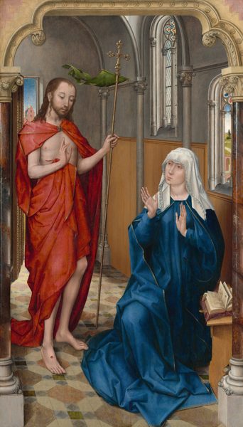 A woman wearing a cobalt-blue robe and a white veil sits with her hands raised, palms out, as she looks toward a slender, bearded man who stands to our left in this vertical painting. Both have light skin and delicate features, and they sit in a room with stone walls and arched windows. There are faint circles under the woman’s light brown eyes. She has a long slender nose, and her pink lips are pursed. One knee is bent, and she is low to the ground, suggesting she sits on a stool. A book lies open on a wooden stand in front of her to our right, below her left elbow. The ruffled edges of her multi-layered, white veil sweep over her forehead and down to her shoulders. Her loose, long-sleeved blue garment is edged with gold and falls in angular folds to pool at her feet. She holds her long-fingered, slender hands up at her chest, palms facing the man to our left. He stands with his body angled toward her as he looks down, his head tipped slightly forward. His brown hair falls over his shoulders. His voluminous, gold-edged, red cloak is fastened at his throat with a gold, jeweled brooch, and it drapes over his shoulders and around his lower torso, leaving his arms, chest, and a gash over his right ribs exposed. He holds a tall, gold staff topped with a jeweled cross in his left hand, to our right. A moss-green pennant flutters back from the base of the cross, as if lifted in a breeze. The man holds up his other hand so the palm faces the woman with the first two fingers raised. Round, puncture wounds with red blood mark the palm of that hand and tops of both bare feet. The floor is patterned with gray, brown, blue, and green tiles. The wall behind the woman has honey-brown paneling along the bottom half and the top half is slate gray. Gray columns are spaced along that wall, supporting a curving, vaulted ceiling. Two arched windows pierce the wall behind the woman, and both have stained glass designs within the curving tops. The window closer to us opens onto a narrow view of a landscape with a rose-pink arch over a bridge, and a path winding through green fields. An open door over the shoulder of the man, to our left, shows the stepped roofline of a pink building under a blue sky. The entire scene is framed with a flattened arch supported by gleaming columns of polished, veined brown stone, creating the impression that we look onto the people and room through the arch. The columns have leafy capitals and white bases. The tan-colored arch is carved with a row of stylized rosettes along the opening that spans the top of the painting.
