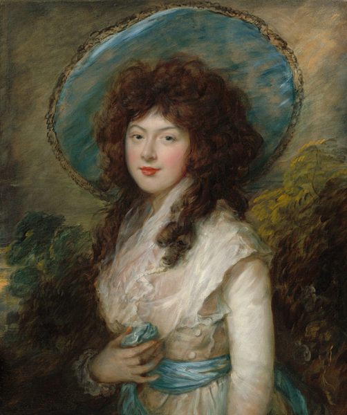 This painting is a portrait of a woman, her torso facing slightly to the left, her face looking directly at us. The woman has fair skin, rosy cheeks, and red lips in a subtle smile. Her hair is dark brown, voluminous, and curled, extending past her shoulders. The woman is dressed in a white gown with ruffled lace and white buttons. She wears a wide-brimmed hat with a blue-grey underside that matches a blue sash around her waist. Her hand rests on her midsection, holding a part of the sash. The background depicts abstract foliage in muted greens and yellows under a gray sky.
