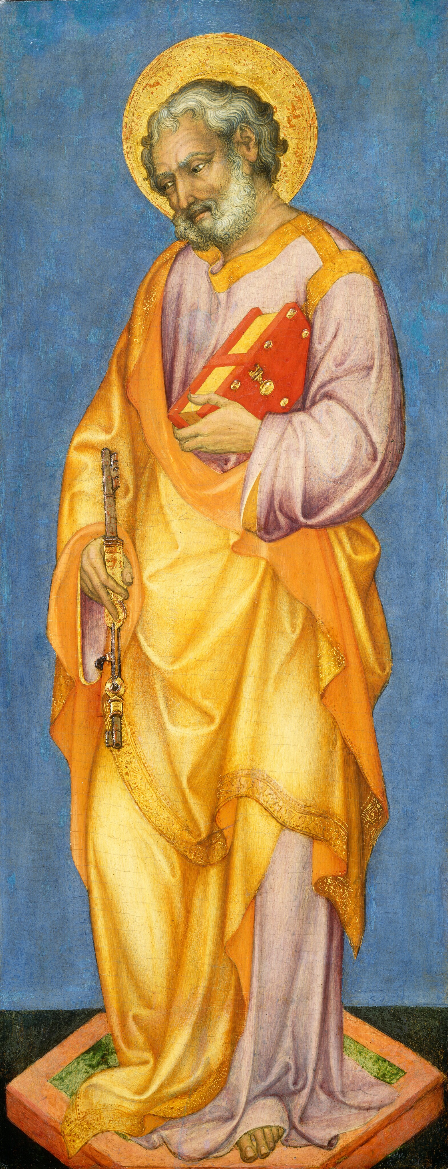 This painting depicts a man standing, slightly turned to the left. He has pale skin, curly, greyish-white hair, and a short gray beard. He wears a golden robe with intricate designs on the hems over a purple garment with gold stripes on the neck and shoulders. He holds a large object in his right hand that looks like a gold key, and in his left hand he holds a red book. A golden halo surrounds his head. He stands barefoot on a small platform with grass within a reddish-brown border against a black surface. Behind him is a blue background.