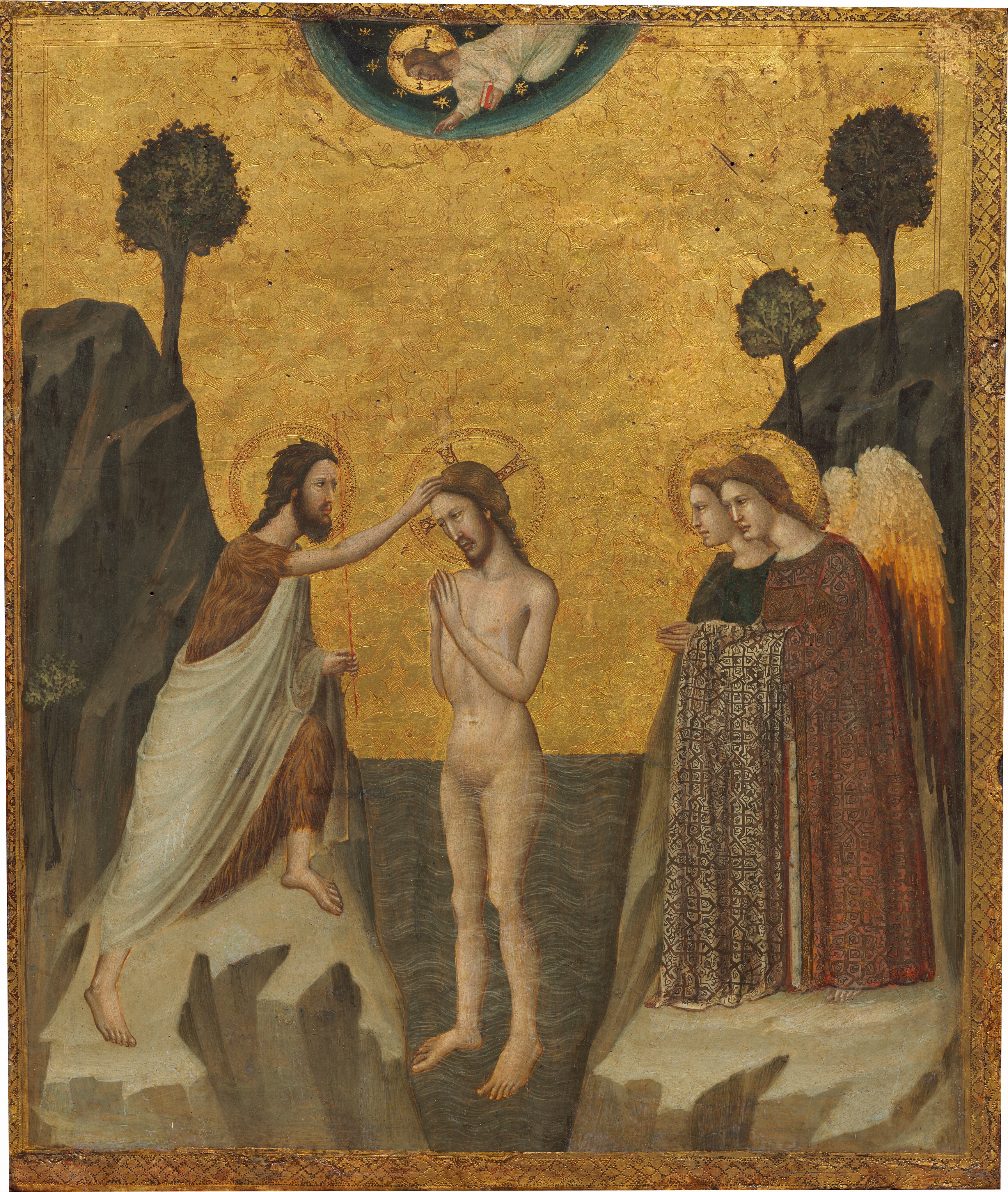 A nude man, Jesus, stands with hands together in prayer, hip-deep in a stylized river with a bearded man wearing a fur-like garment on a rocky bank to one side and two winged angels on the other, all against a gleaming gold background in this vertical painting. Another bearded man wearing a white robe floats in a blue field at the top center of the panel. All the people have pale skin, brown hair, and gold halos encircle their heads. At the center of the painting, Jesus’s body is angled to our left, and he tips his head the same direction. Jesus has shoulder-length hair and a trimmed beard. Slate-blue water reaching his hips is painted with regular, white, curving lines to suggest flowing water. Standing on the flat top of a tan-colored rock to our left, the other man head has raggedy, darker brown hair and a fuller beard. His brow is furrowed, and he has dark eyes. He wears the brown, fur-like garment under a white robe. He steps forward on his left foot, farther from us, to touch Jesus’s head with his right hand, and he holds a staff in his other hand. To our right, the angels stand side-by-side facing Jesus. The angel farther from us wears indigo blue and the one closer to us wears a brick-red, patterned, long robe over bare feet. A swath of beige, geometrically patterned fabric drapes over that angel’s arm, whose hands are also held together in prayer. Their wings darken from cream-white at the top to golden yellow, then burnt orange at the bottom. Stylized trees, one to our left and two to our right, grow from the rocky hills beyond the people. In a half-circle at the top, a man smaller in scale hovers, chest down, over the scene. He lifts his right hand toward Jesus and holds a book with a crimson-red cover with his other hand. The semi-circle fades from deep teal at the center to pale aquamarine blue at the outer edge, and is painted with gold starbursts. The entire scene has a gold border with clover-like forms set within diamonds along the inner edge of the panel.