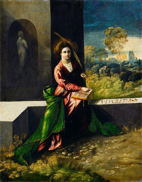 This painting shows a woman seated outdoors, looking towards the right. She has a fair complexion, a round face, and dark brown hair styled back under a large gold headdress. She wears a pinkish-red gown with a green cloak or blanket around her skirts, and she holds a golden palm frond in one hand and points to an open book that rests on her knees with the other. She has a gold necklace or small collar around her neck and a halo of small golden dots around her head. The background on the left features a gray building in shadow, with a tall gray statue standing in a niche. The background on the right features green trees and distant blue buildings under a dark blue sky that is lighter at the horizon. The ground is covered with grass and small stones, and she sits on a flat gray surface.