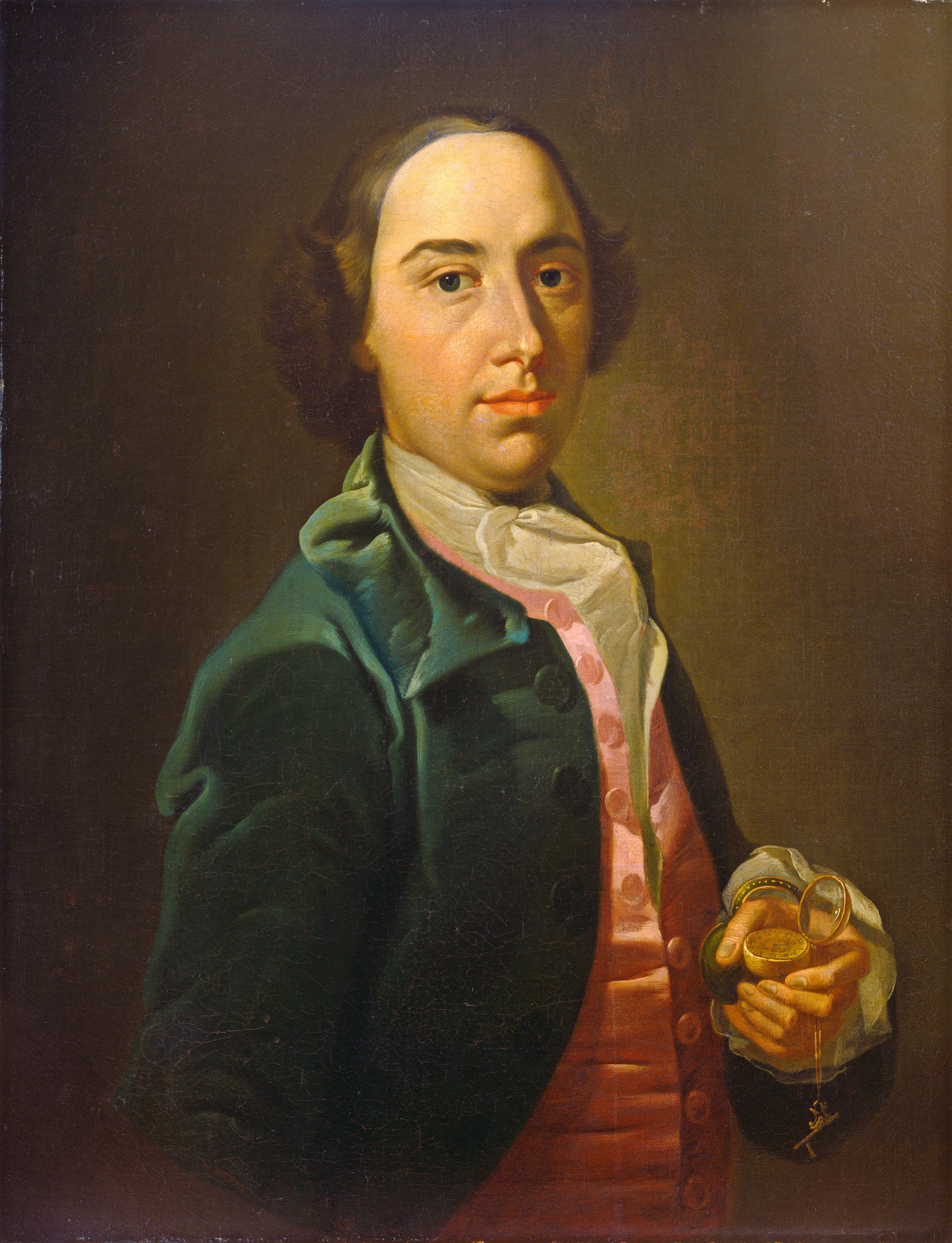 The image is a portrait of a man. He is positioned slightly angled towards the left, looking directly at the viewer. He has a youthful face with a fair complexion, brown eyes, and dark brown hair styled back. He is wearing a dark green coat over a pink waistcoat with large buttons and a white cravat. In his right hand, he is holding an open pocket watch attached to a chain with a small cross hanging from it. The background is plain dark brown.