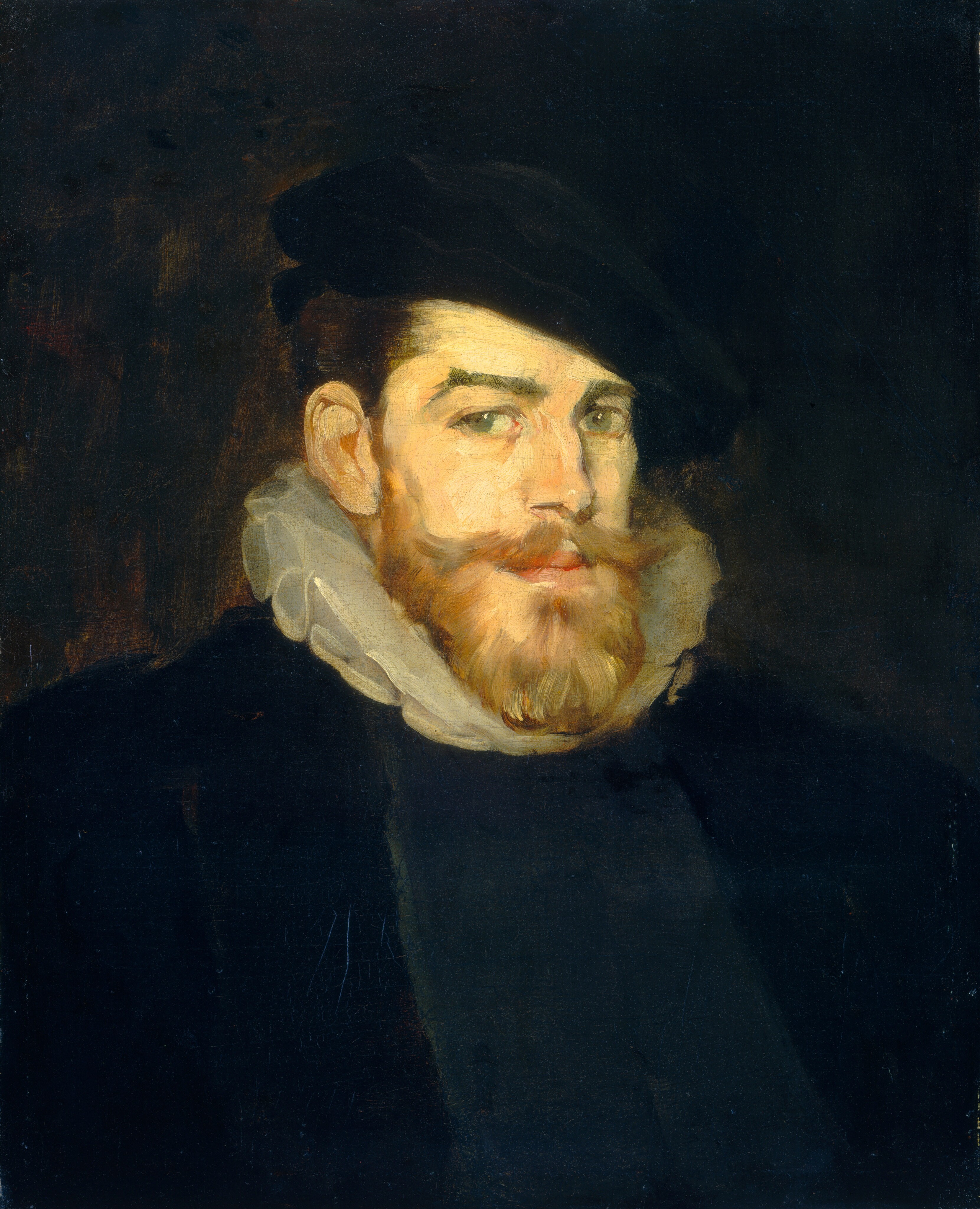 The image shows a man with a full beard and mustache wearing a black garment with a white ruffled collar. He is looking directly at the viewer and positioned to the left, with a dark background behind him.