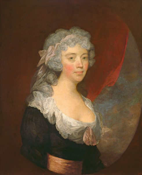 This painting shows an upper body portrait of a woman with her body slightly turned to the right and her head facing us. She has light-colored skin, rosy cheeks, green eyes, and pink lips set in a neutral expression. Her curly gray hair is tied with a light pink ribbon. She wears a dark dress with a low neckline lined with lace and a pink bow at the center, and a light orange-pink sash around her waist. Behind her is a dark red curtain on the left, and a blue sky on the right, covered in brown and gray clouds. The portrait is enclosed in an oval which is set against a dark brown background.