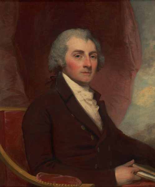 This painting is a portrait of a seated man. His body is facing the right with his head turned to us, a neutral expression on his face. The man has pale skin, rosy cheeks, bright blue eyes, thin lips, and gray hair that curls around his ears. He is dressed formally in a dark red coat with gold buttons and a white cravat at his neck, sitting in a red upholstered chair, holding a book in his right hand. The background consists of red drapery on one side and blue and yellow hues on the other, suggesting a cloudy sky.