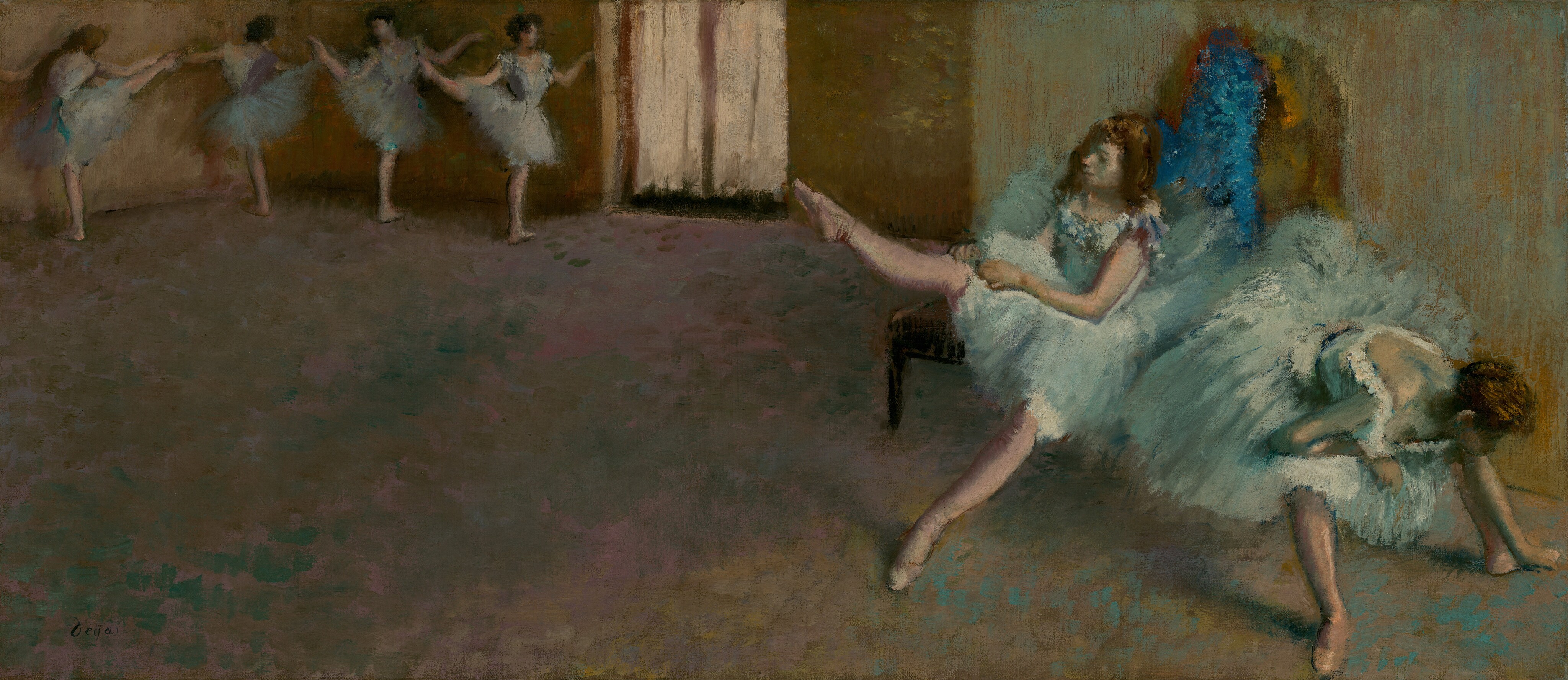In a dance studio, two ballerinas wearing knee-length tutus and ballet slippers sit on a bench and stretch to our right while four more pose at the back of the space, to our left, in this long, horizontal painting. The scene and dancers are loosely painted so many features are indistinct. All the women have light skin and dark brown hair. Each pale, robins’ egg-blue costume has a low-cut, tightly fitting, sleeveless bodice and a full skirt. Dabs of off white, teal, and blue suggest flowers lining the deep U of the neckline at the front and down the back of each bodice. Closest to us and nearly brushing the edges of the lower right corner of the canvas, one dancer sits on the end of a wooden bench and leans down between her legs, her feet widely planted. She rests her torso on an elbow folded onto one knee as she reaches for her left foot, farther from us, with her other hand. Her hair is pulled up and her face, looking downward, is deep in shadow. Sitting behind her on the bench, to our left, a second dancer lifts her right leg, toe pointing, as she pulls on her pale pink tights. Her other leg stretches straight, pointed toe brushing the floor, in front of her. This woman’s hair hangs loose around her shoulders. The pair is brightly lit from a source to our right, and an arched area of electric blue and mustard yellow behind them is difficult to interpret. The floor, which takes up about two-thirds of the composition, is painted with dabs of teal blue, pale fuchsia pink, and caramel brown. It leads us back to the upper left corner of the painting where four more four ballerinas stand in a line. The pair to our left stands with their backs to us, facing the wall with their right legs raised to shoulder height, toes pointed. The pair to our right faces us. They also stand with their right legs raised, creating a wide angle with their standing legs. All four ballerinas bend their arms gently at the elbow, and some tip their heads toward the raised legs. The rightmost dancer is illuminated by a pair of French doors at the back corner, at the top center of the painting. The wall behind the bench is streaked with mint green over honey brown, and the wall at the back of the room is leather brown. The visible, soft brushstrokes give the image a blurred, ethereal appearance in the dimmed studio. The artist signed the painting in the lower left corner, “Degas.”