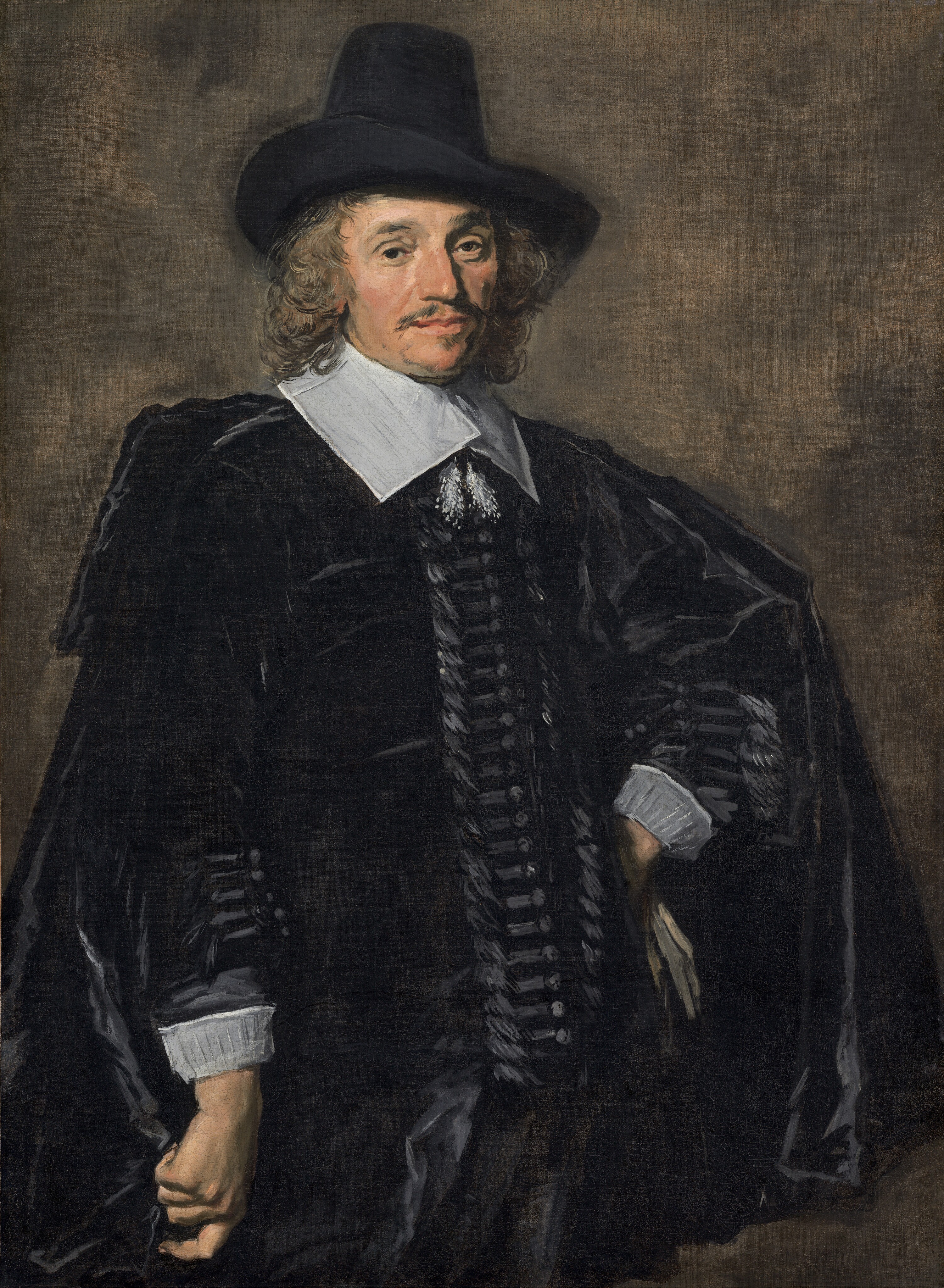 Shown from the thighs up, a man with pale, peachy skin, wearing a black suit, cape, and hat, stands with one hand on his hip against an elephant-gray background in this vertical portrait painting. The portrait is loosely painted in some areas, especially in the clothing and background, though the face is more detailed. His body is angled slightly to our right so one shoulder juts toward us, to our left, and he turns his face to look at us brown eyes. One bushy brow is slightly arched. He has a long, bumped nose, soft jowls along his jawline, and perhaps a mole almost lost in shadow on his left cheek, to our right. His wide, pale peach lips are closed and framed by a thin, brushy mustache and a patch of hair under his lower lip. His shoulder-length, wavy, light brown hair curls around his face, and he wears a tall, black hat with a wide brim turned over his right ear, to our left. A hip-length black cloak drapes over a long-sleeved black jacket. A wide, flat, white collar lies across his shoulders and is tied with fluffy tassels that hang on his chest. Streaks of slate-gray suggest horizontal bands next to buttons down the front of his jacket and along the forearms, above white cuffs. He stands with his right arm, to our left, hanging by his side, and he holds the fabric of his cloak in a loose fist. The back of his other hand rests against his left hip, to our right, and a few streaks of parchment brown suggest a glove in that hand. The background is painted with thin, blended areas of gray and peanut brown.