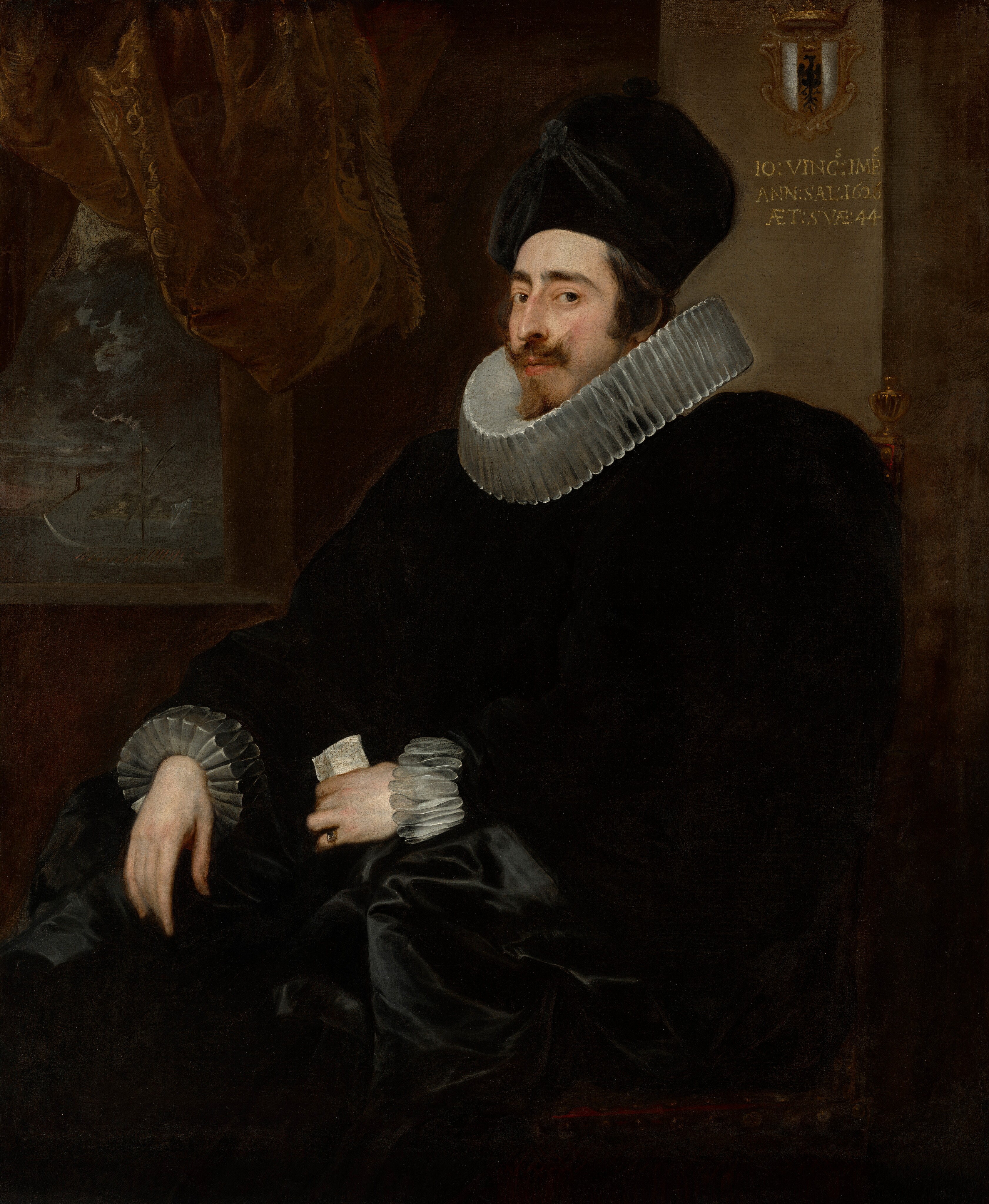Shown from the knees up, a pale-skinned man wears a tall, black hat, wide white ruffs at the neck and cuffs, and a voluminous black garment in this vertical portrait painting. The dark costume nearly blends into the brown background in some places, so details are difficult to make out. The man sits in a chair so his body and knees are angled to our left. His face is also turned in that direction, but he looks at us from the corners of his brown eyes under dark, heavy brows. He has a thin face with a long, bumped nose. His brown mustache flicks up at the outer ends, and a thin line of hair down his chin creates his beard. His black hat has a high, rounded top and is draped with black fabric and a rosette. The ruffs at his neck and cuffs are pleated into tall, narrow figure eights. His black garment appears to puff widely at the shoulders and fold back over his lap. He wears a ring on the pinky finger of his left hand, which holds a piece of paper. The other hand hangs limp from where his arm rests on the chair, which appears to be upholstered in dark maroon-red fabric and is topped at the back with gold finials. A square window pierces the brown wall behind the man in the top left quadrant of the canvas. A few gold lines glint on the fringed brown curtain pulled up over the window, which opens onto a dark, perhaps nighttime landscape. A coat of arms hangs on the wall behind the chair, to our right of the man’s head. A shield is vertically striped with white to either side of a red stripe with a bird of prey silhouetted in black beneath a gold crown. Gold lettering on the wall below reads, “IO: VINSS: IMPS. ANN: SAL: 1626 AET: SVAE: 44.”
