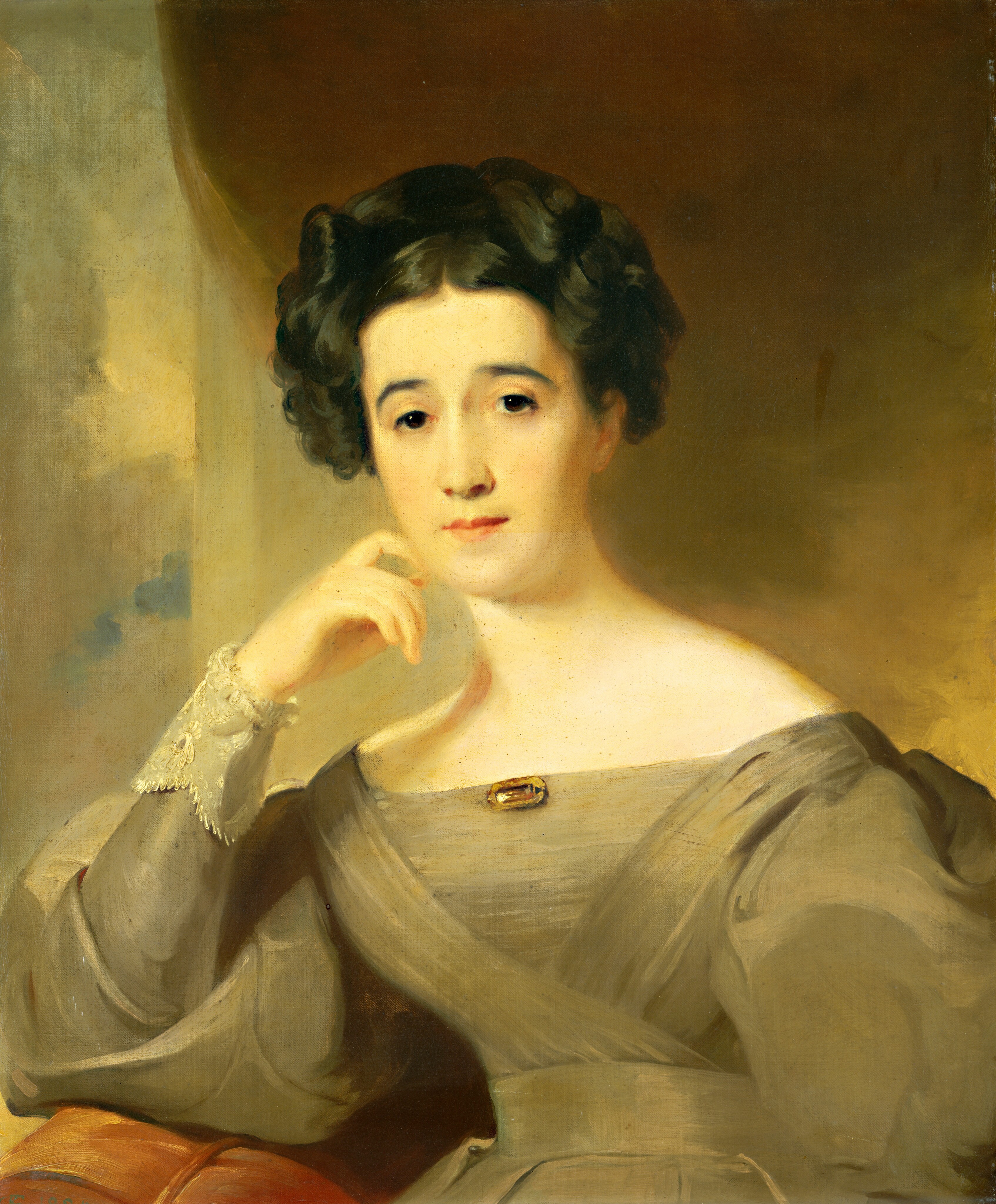 The portrait shows a woman from the waist up. She is facing the viewer with her body slightly turned to the right. Her right hand is touching her cheek. She has finely arched eyebrows, large eyes, and a small mouth. Her dark hair is styled elegantly with ringlets. She wears a gray dress with a wide neckline, lace cuffs, and a brooch at the center of her chest. The background is a blend of brown and ochre tones.