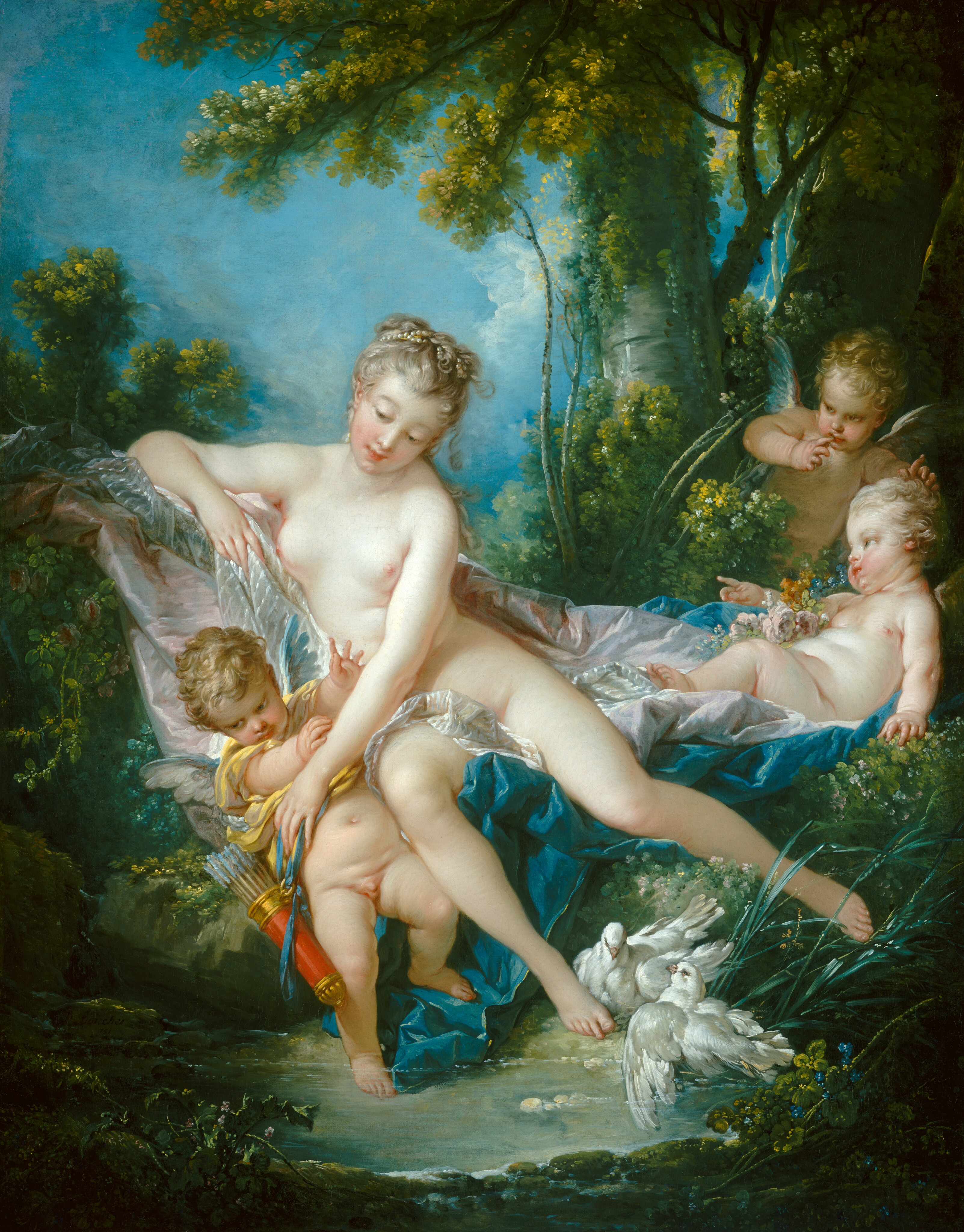 A nude woman and three small, winged children gather among bushes and lush vegetation at the edge of a clear pool in this vertical painting. All four have pale skin and blond hair. The children are pudgy with baby-like proportions and have short gray and blue wings. The woman half reclines on swaths of white, pale pink, and peacock-blue fabric draped across the bushes or the ground. She leans her torso to our left and leans toward that elbow, which is propped up on the fabric. The toes of her right foot, on our left, brush the ground near the water, and her other leg is angled to continue the diagonal created by her elbow and torso. Two white doves nestle by her lower foot. Her ash-blond hair is bound up with pearls, and she has rosy cheeks, pink bow lips, and smooth skin. She reaches across her body and down to our left to touch a nearly nude young boy. He wears a butter-yellow garment pulled up around his chest, perhaps by the woman. A quiver of arrows hangs from a blue ribbon at his side, and he raises his hands before him, toward the woman's arm. To our right, one of the other children reclines on the pink and blue drapery and faces the woman in profile. The third child leans forward from the bushes behind the reclining child. The bushes and trees of the lush forest around the figures creates a V-shape with the people at the center. Vibrant blue sky fills the upper left quarter of the painting.