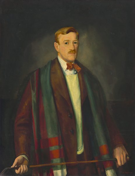 This painting shows a man from the waist up, his body turned slightly to the right. He stands upright, looking at the viewer, holding a golf club or cane horizontally with both hands. The man has a neutral facial expression and a light complexion, a blond mustache, and neatly combed blond hair. He wears a white shirt under a pale yellow sweater and a brown coat, along with a red bow tie. He also has a long, multi-colored scarf draped over his shoulders with red and green stripes visible. The background is gray and becomes slightly lighter around the man's head and darker around the edges.