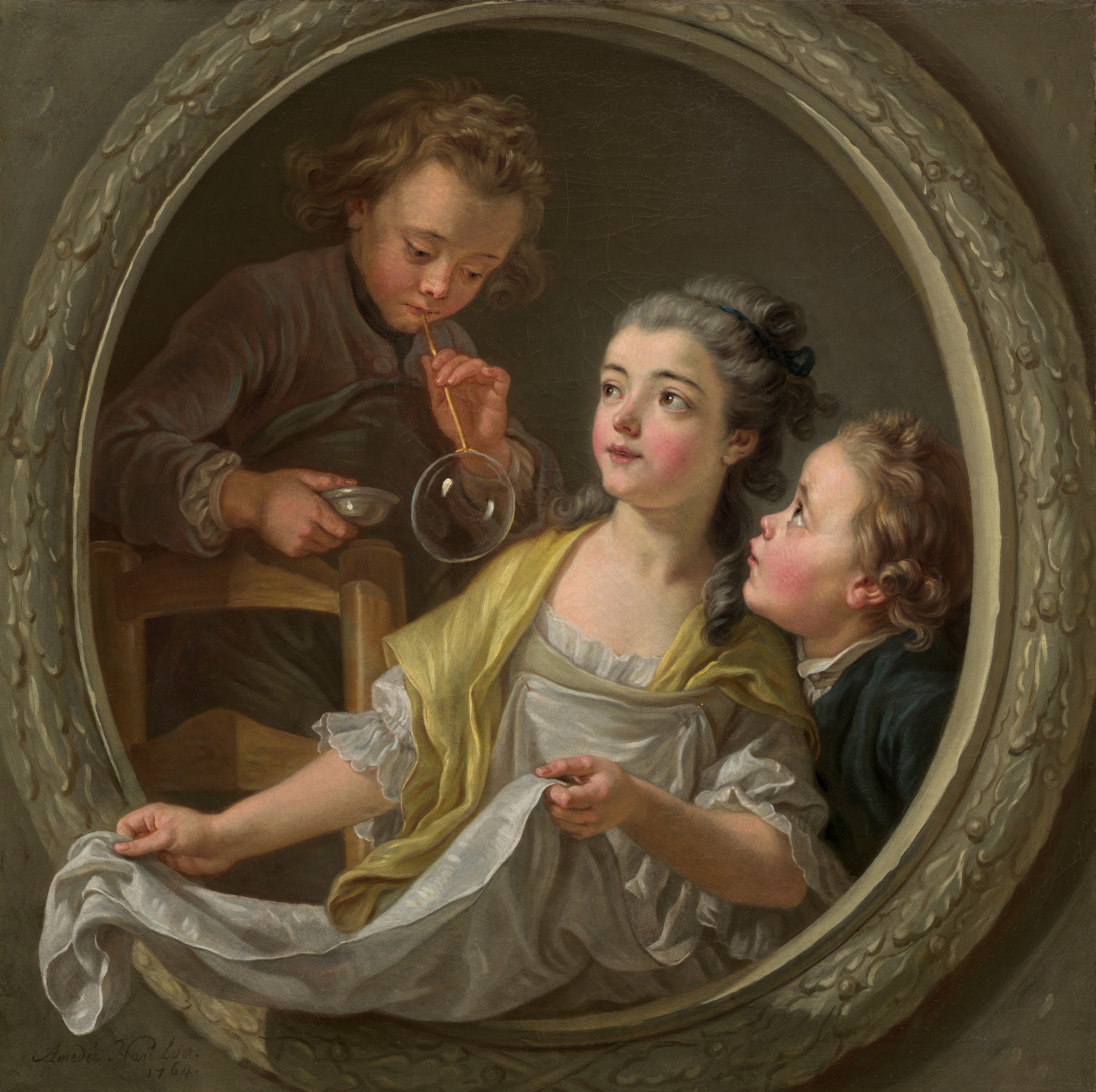 The painting depicts three children within an oval frame, their upper bodies visible. The central child, a young girl, is positioned with her body facing forward and her head turned slightly to the left. She has a fair complexion, with rosy cheeks, pink lips, and wide brown eyes. Her hair is gray and partially pulled back by a blue ribbon. She is dressed in a white garment with a yellow shawl draped over her shoulders. Her arms are outstretched, holding the ends of a cloth that has been pinned on her dress. Her arms and the cloth extend forward beyond the oval frame that encircles the trio, as if the frame is a window or porthole that she is reaching out of. On the right, a boy leans on the girl's shoulder, also facing to the left, seen in profile. He has light brown, curly hair and a fair complexion. He wears a dark blue-green jacket over a white collar, and he is looking upward towards the third child. On the left, another boy, who also has light skin and light brown curly hair, appears to stand on a chair above the other two children. He is holding a long yellow straw up to his lips. At the other end of the straw, a large bubble hangs over the white cloth that the girl holds out. In his other hand is a small white dish. He wears a muted brown outfit with a dark cloth wrapped around him. The background within the frame is plain gray, and the frame that surrounds the children is light gray and appears to be carved with leaf designs. Beyond the oval frame is gray.