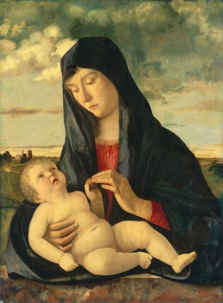 Shown from the waist up behind a stone ledge, a young woman nestles a nude baby against her chest in this vertical painting. Both have pale skin with a slight, rosy blush on their cheeks, and both have halos painted as delicate gold rings around their heads. The woman’s shoulders are angled to our left, and she looks down at the baby in that direction with hooded eyes. She has a slender face, a long, straight nose, smooth cheeks, and her pale pink lips are closed. The neckline and the cuffs of her garnet-red, gold-edged gown peek out from beneath a dark, spruce-blue mantle that covers her head and wraps around her body. She rests the baby along the stone ledge and holds him in the crook of her right elbow, to our left. In her other hand, she holds a small object, perhaps an apple. The baby also touches the fruit as he lies back along her arm. He has curly, ash-blond hair, a petite nose, and chubby cheeks. He looks up at the woman or beyond her with parted, downturned lips. The pair are warmly lit from the upper left and set against a fern and olive-green landscape. Near the left edge of the painting, a church and steeple are silhouetted along the horizon, which comes just under halfway up the composition. In the sky above, a clear, pale blue horizon gives way first to puffy, cream-white clouds and then swirling clouds in tones of pine green and slate gray along the top of the picture. An inscription appears on the lower center of the ledge, “IDEM Z.B.”