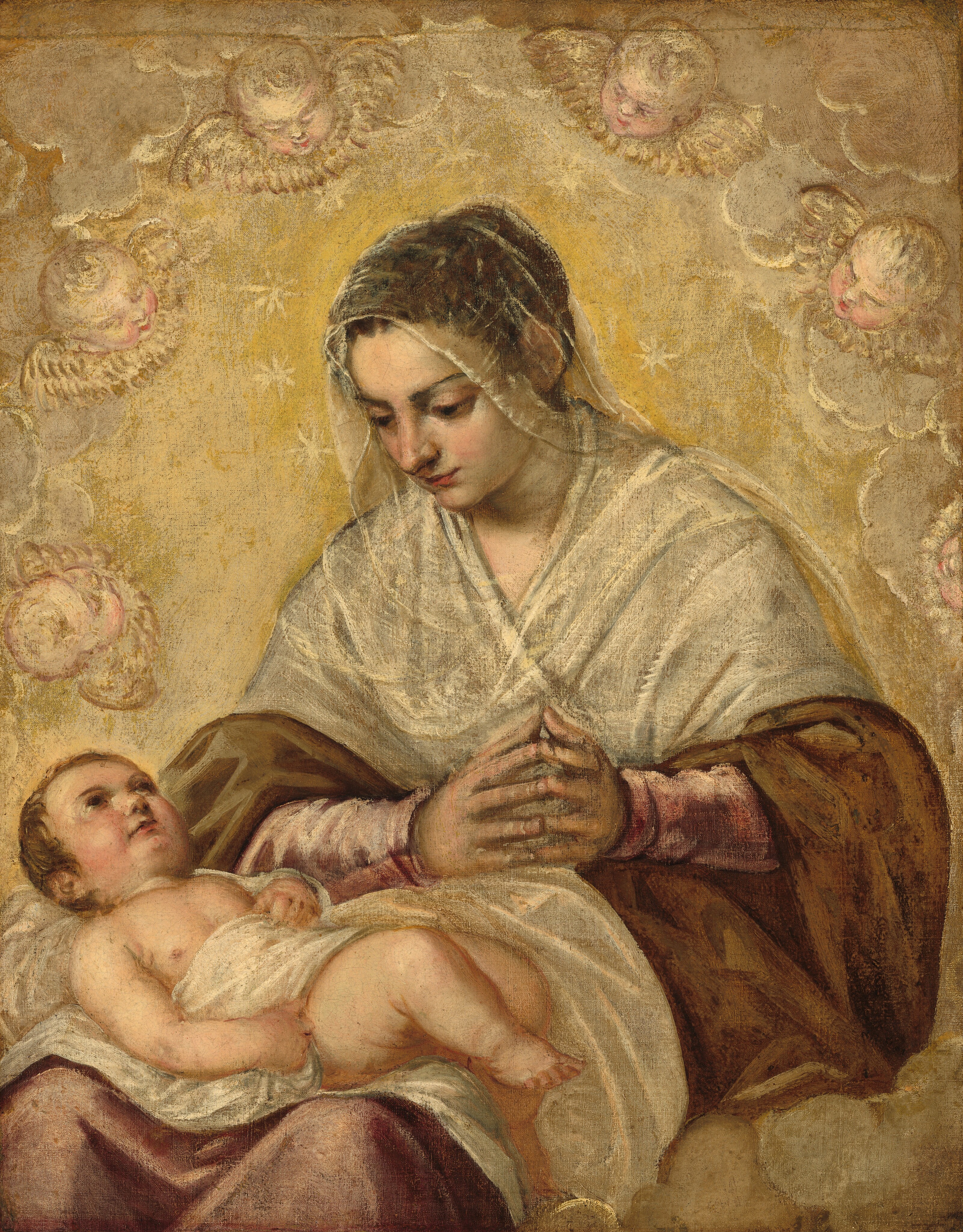 Shown from the knees up, a seated woman is surrounded by an arch of disembodied, winged baby heads as she gazes down at an infant lying across her lap in this vertical painting. They all have pale, peachy skin, and are placed against a honey-gold background. The floating heads are all angled inward to face the woman. The woman sits on straw-yellow clouds that billow up from the lower right corner, and more clouds fill the upper corners around the floating heads. The woman and baby take up most of the canvas. The woman’s knees are angled to our left but her upper body turns to us. Her hands are together, fingertips touching and coming toward us. Her chestnut-brown hair is pulled back and gathered at the back of her head, and is covered by a translucent white veil that falls to her shoulders. Her shoulders and upper arms are wrapped in an ivory-white shawl over a fawn-brown dress with rose-pink sleeves. Pale yellow stars create a ring around her head, which tilts down as she gazes toward the child with large brown eyes. The plump baby lies on his back, with his head resting on the woman’s right leg, farther from us. He has short, brown hair with dark eyes looking straight up. The white cloth on which he lies wraps around his midsection and upper thighs. One hand rests on his belly and the other by his side, and his chubby knees are bent over the woman’s leg.