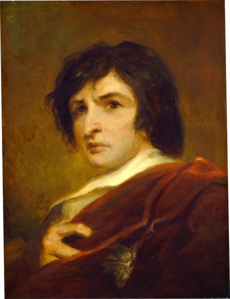 The image shows a portrait of a person's upper body, capturing their head, neck, and part of their shoulders. The person is positioned facing slightly to the right, with their head turned towards the viewer. They have dark, tousled hair and defined facial features with a focused expression. The individual is wearing a rich, dark red garment draped over their shoulders, with a white collar visible underneath. In their hand, they are clutching the fabric of the garment, and there appears to be an ornate piece near the garment's edge. The background is muted and warm-toned.