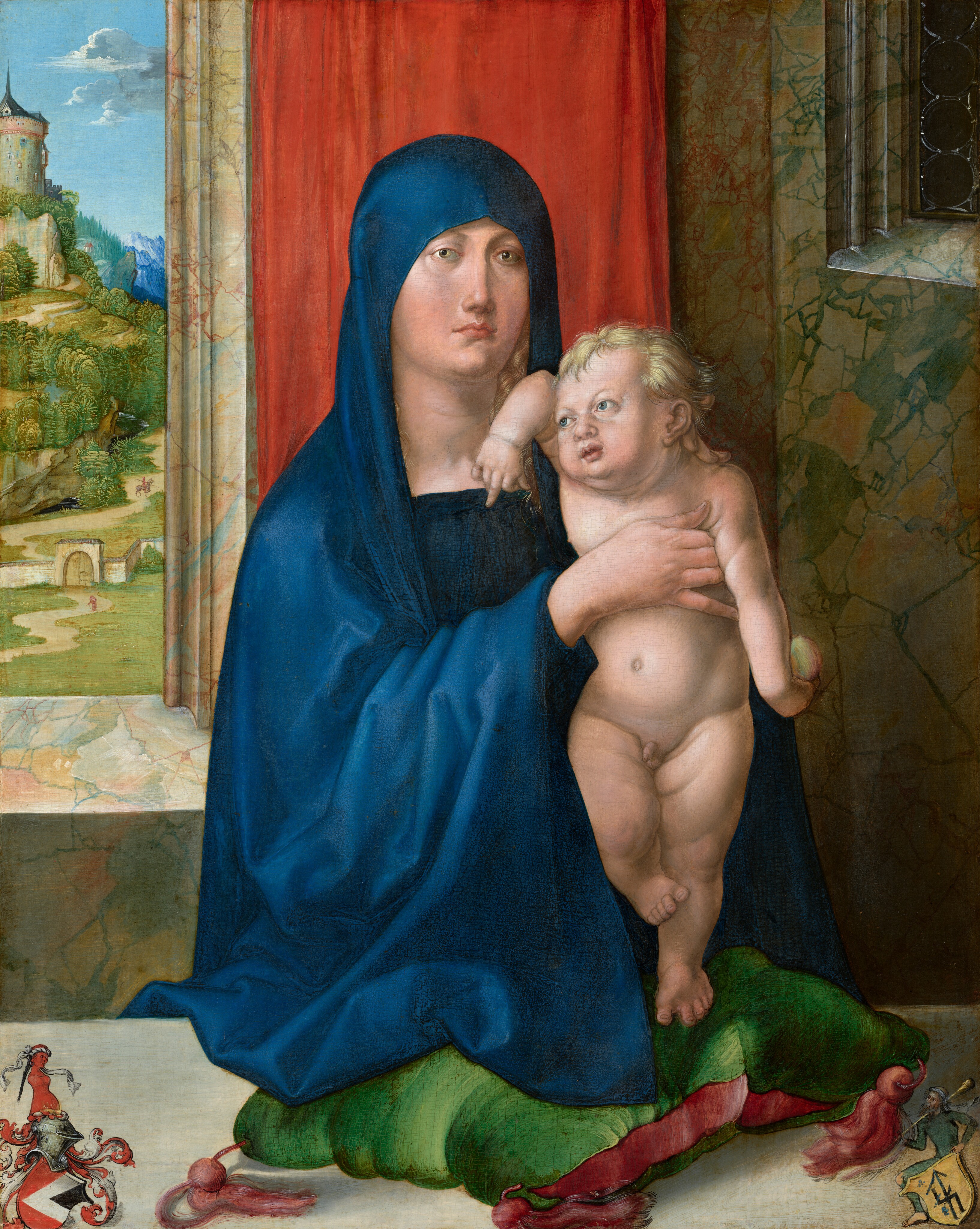 Shown from the hips up in a room on the far side of a ledge, a young woman props up a naked baby so he stands on a cushion in this vertical painting. The woman’s left hand, to our right, supports the baby’s neck, and her other hand holds him upright. Both have pale skin tinged with pink and shaded with cool gray, and they face us at the center of the composition. The woman wears a royal-blue hooded garment that comes low over her forehead. Light blond curls catch the light under her hood, near her left cheek, to our right. She looks into the distance, as if over our right shoulder, with unfocused, pale brown eyes. She has a straight yet soft nose, flushed cheeks, closed pink lips, and a slight double chin. The nude baby has blond hair and blue eyes. His torso and limbs have the rolls and dimples of a toddler, and the woman’s hands press gently into the flesh. One of his elbows hooks up over the woman’s shoulder, next to his head. He points at the woman with his middle finger near her high neckline. The other arm, to our right, hangs by his side and he holds a piece of green and red fruit, possibly an apple. The child stands on one foot on the green cushion, which has red tassels. The pine-green pillow has sea glass-green highlights, suggesting a sheen or texture. His other foot rests against that standing calf, toes splayed. The wall behind the pair is marbled with green or red against tan, and a bright, scarlet-red cloth hangs behind the woman. A window on the back wall opens onto a landscape to our left. There, a plain of green grass is interrupted by a winding pathway, which leads to a walled fortification and gate. Beyond the gate are trees and mountains, hazy green and blue in the deep distance. Thick white clouds drift across the bright blue sky above. A sliver of a window in the upper right corner next to the baby has round, bull’s eye glass. In the lower corners of the painting are two heraldic coats of arms. The shield-shaped symbol to our left is of a knight’s helmet with red and white scrolls and vines. In the lower right corner a miniature man kneels behind a shield and holds a long cylindrical object.
