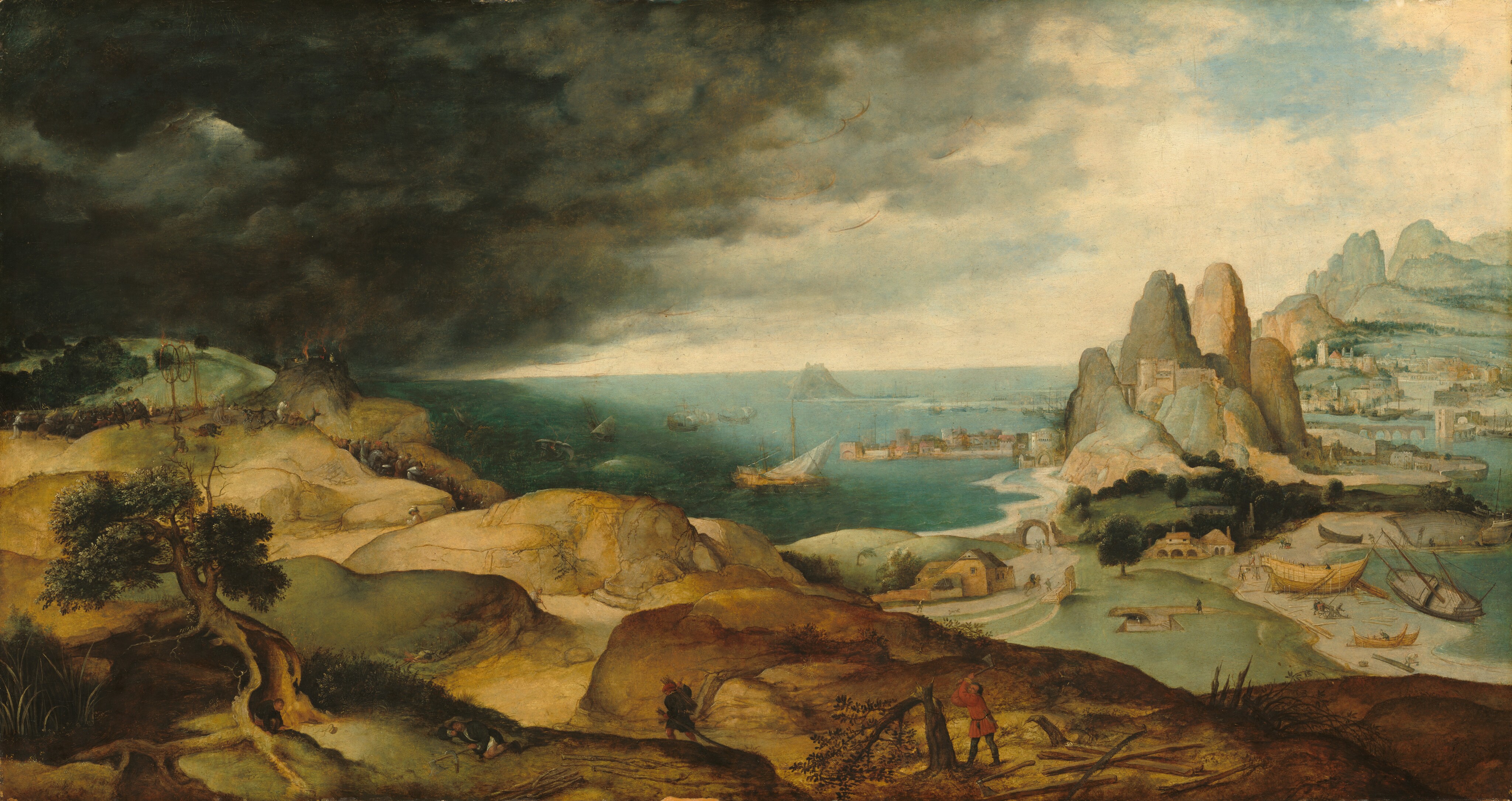 We float high above the land, looking across rolling hills toward a shimmering, aquamarine-blue body of water to our left and towns peppered along taller mountains to our right, beneath an incoming storm in this horizontal painting. The horizon comes about halfway up the painting. Only upon closer inspection does one discover dozens of tiny men and women scattered in groups or individually across the landscape. Closest to us but still tiny in scale, at the lower center, a man wearing a scarlet-red tunic and dark pants chops down a tree as another man wearing navy blue walks away from us. A man snoozes on the grass nearby and another squats in the protection of a hollowed out tree, pants down, in the lower left corner of the painting. The rolling, light brown hills angle away from us to our left. Atop a hill to our left, a tall frame holds up two flaming wheels. At its foot, a person wearing robes kneels and looks up, arms raised, at the wheel, which is on fire. Three people, one wearing armor, lie nearby and others run away. A structure on a rocky outcropping nearby is also on fire, and black smoke billows skyward. In the harbor below, at the center of the composition, two ships tip wildly in the water. People walk and work in pairs and groups through the rest of the landscape, including a bustle of activity around a wooden ship being built to our right. Travelers on foot and on horseback follow a winding road along the harbor toward a castle on the far promontory. Beyond that lies a ship-filled port town, and, across a drawbridge on at the far right, a walled city in the hazy distance. Clouds rolling across the left half of the painting are charcoal gray, almost black. To our right, patches of bright blue sky peek through a thin screen of white clouds.
