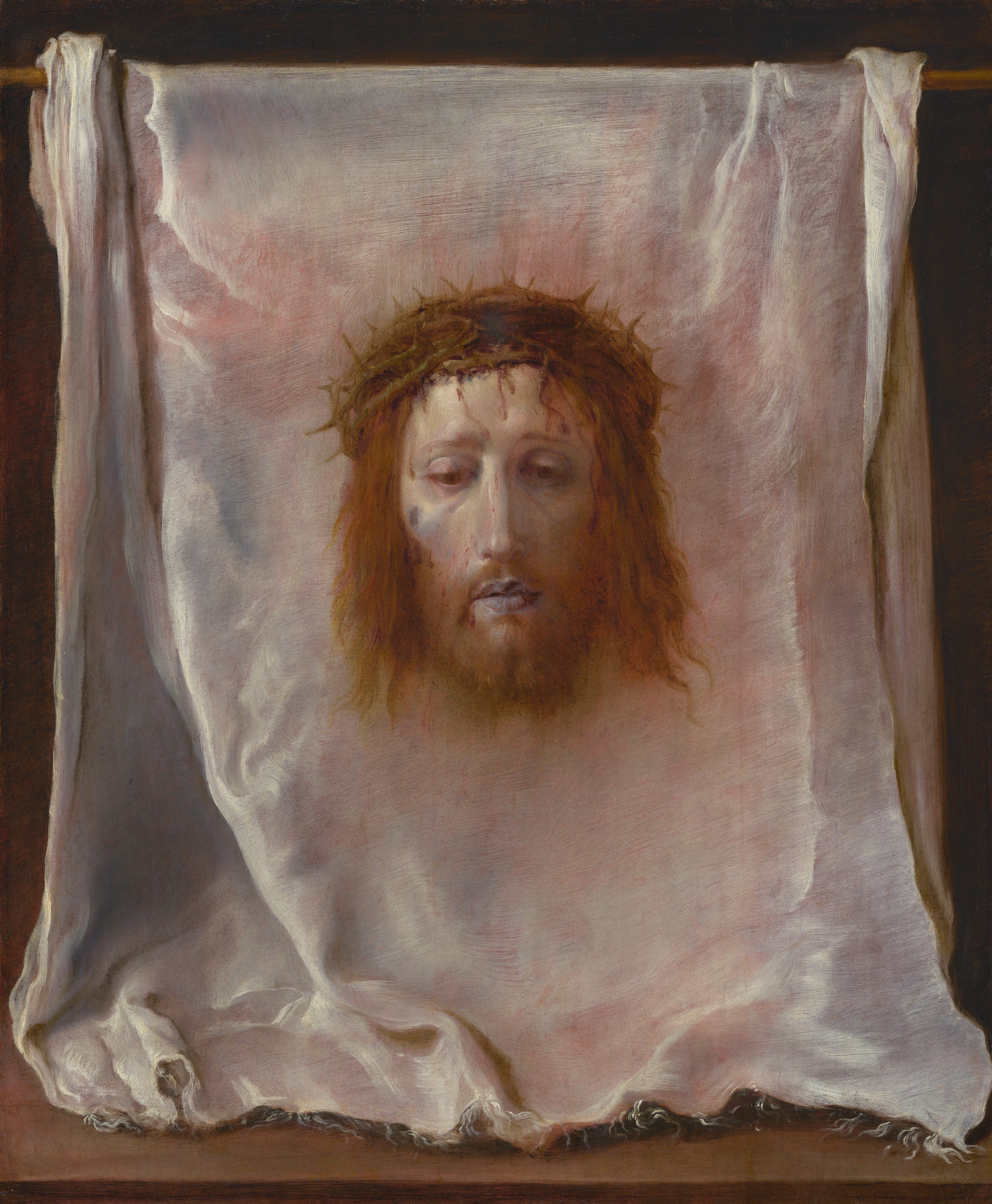 The head and pale face of a bearded man with a ring of interwoven branches of thorns over his chin-length, wavy, reddish-brown hair floats against a white cloth that has been hung over a wooden rod in this vertical painting. The cloth fills the composition. At its center, the man’s head faces us and he looks down with heavy-lidded, brown eyes. His lips are parted, and his cheeks are slightly sunken and shaded with pale lilac purple under high cheekbones. Blood drips down the man’s pallid forehead from the thorns. A brown spot high on his right cheek, on our left, might be a bruise or injury. A soft brown glow surrounds the head. The white cloth is frayed along its front edge, where it rests facing us on a wooden surface along the bottom edge of the painting. The cloth is bunched a little to each side where it drapes over the wooden rod above. The white cloth is painted with tones of pale coral pink, icy blue, silvery white, and dove gray. The background behind the cloth is black.