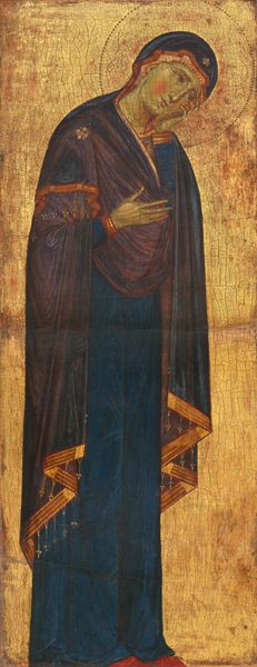 Shown against a shiny gold background, a woman wearing a royal-blue mantle that covers her head and body stands with her head tipped sharply to rest in one hand in this vertical painting. Her skin is pale with a noticeably green tint. She tilts her head to our right and looks in that direction with brown eyes. Her right cheek flushes with a bright pink circle, and three horizontal pale yellow strokes indicate wrinkles at the corner of the eye closer to us. Visible strokes in butter yellow define her chin, nose, wrinkles on her furrowed forehead, and neck. A dark violet-purple cloth hangs over the shoulders of her blue mantle. A four-lobed design, perhaps a flower, is painted on her right shoulder, closer to us. The purple cloth is edged with gold, and tiny tassels with clover-shaped ends hang from the bottom hem. The blue mantle drapes over pointed, red shoes. A halo around her head is punched and incised into the gold background. A network of cracks runs across the gold background, and the red layer underneath is visible in some areas.