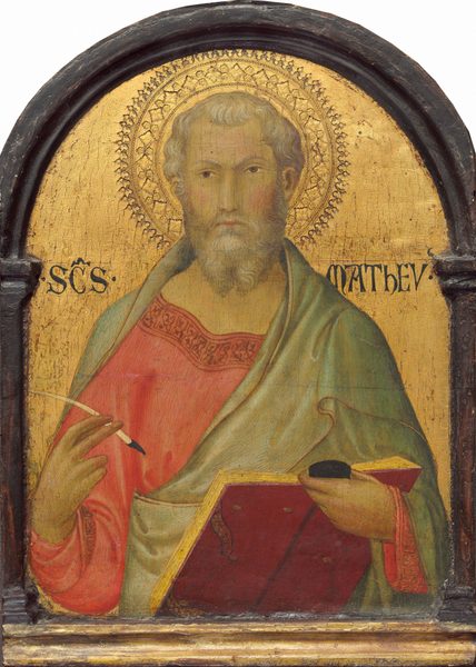 This painting shows a man from the waist up, facing us. The man has pale yellow skin, rosy cheeks, a long, straight nose, brown eyes, a full gray beard, and wavy gray hair. He wears a light red garment with intricate designs along the neckline under a pale green outer cloak. In his left hand, he holds an open red book and a black inkpot. His right hand holds a quill pen. A halo with a detailed pattern surrounds the man's head. The background is a gold surface within an arched black wooden frame.