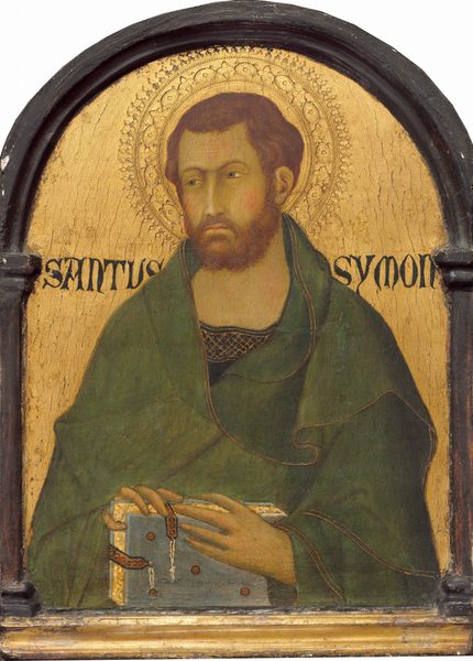 This painting shows the upper body of a man. The man has short, dark, wavy hair and a beard, and he wears a green robe over a dark garment with a neckline decorated with a gold pattern. He looks to the left, and has pale skin, rosy cheeks, arched eyebrows, and thin lips. He is holding a light blue book in his hands. Behind him, the background is golden, and there is an ornate halo surrounding his head. The words "SANTUS SYMON" are on either side of the man's head in a dark script. The painting is framed in a dark, arched border.