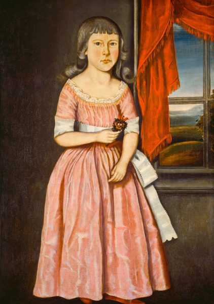 The image shows a young girl standing next to a window. Her eyes are looking directly at the viewer. She has fair skin, dark eyebrows, and dark hair with bangs. She is wearing a pink dress with short sleeves, a white ribbon tied around the waist and sleeves, and lace at the neckline. She is holding a small bouquet of flowers. The background features a red curtain beside the window and a view of a blue sky and greenery outside.