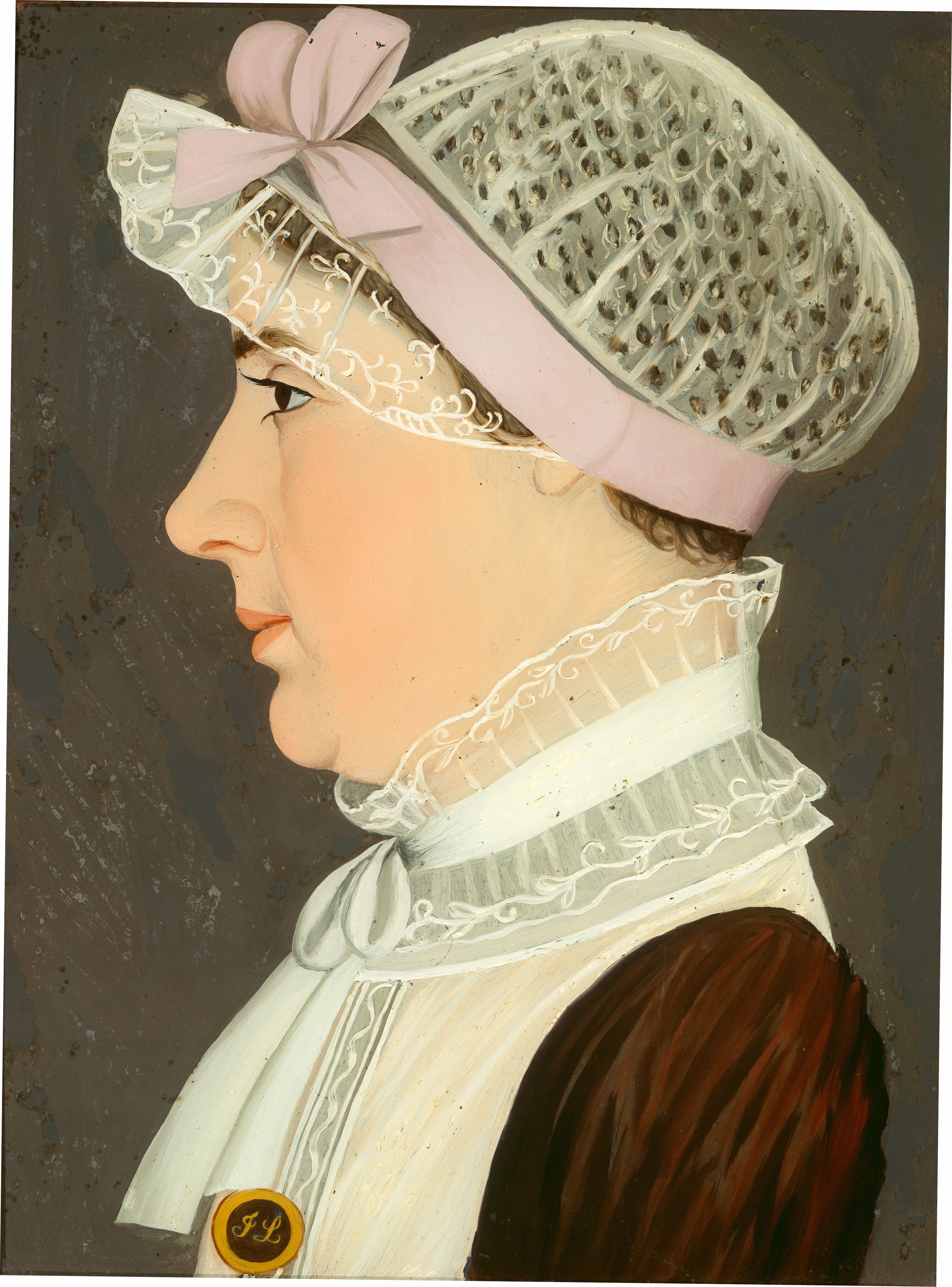 The image depicts a side profile of a person with fair skin, high cheekbones, a prominent nose, a lace cap featuring a pink ribbon, a high-collared white garment with lace trim and a bow at the neck, a brown garment on the shoulder, and a round badge with the initials "JL." The background is a solid, muted gray color.