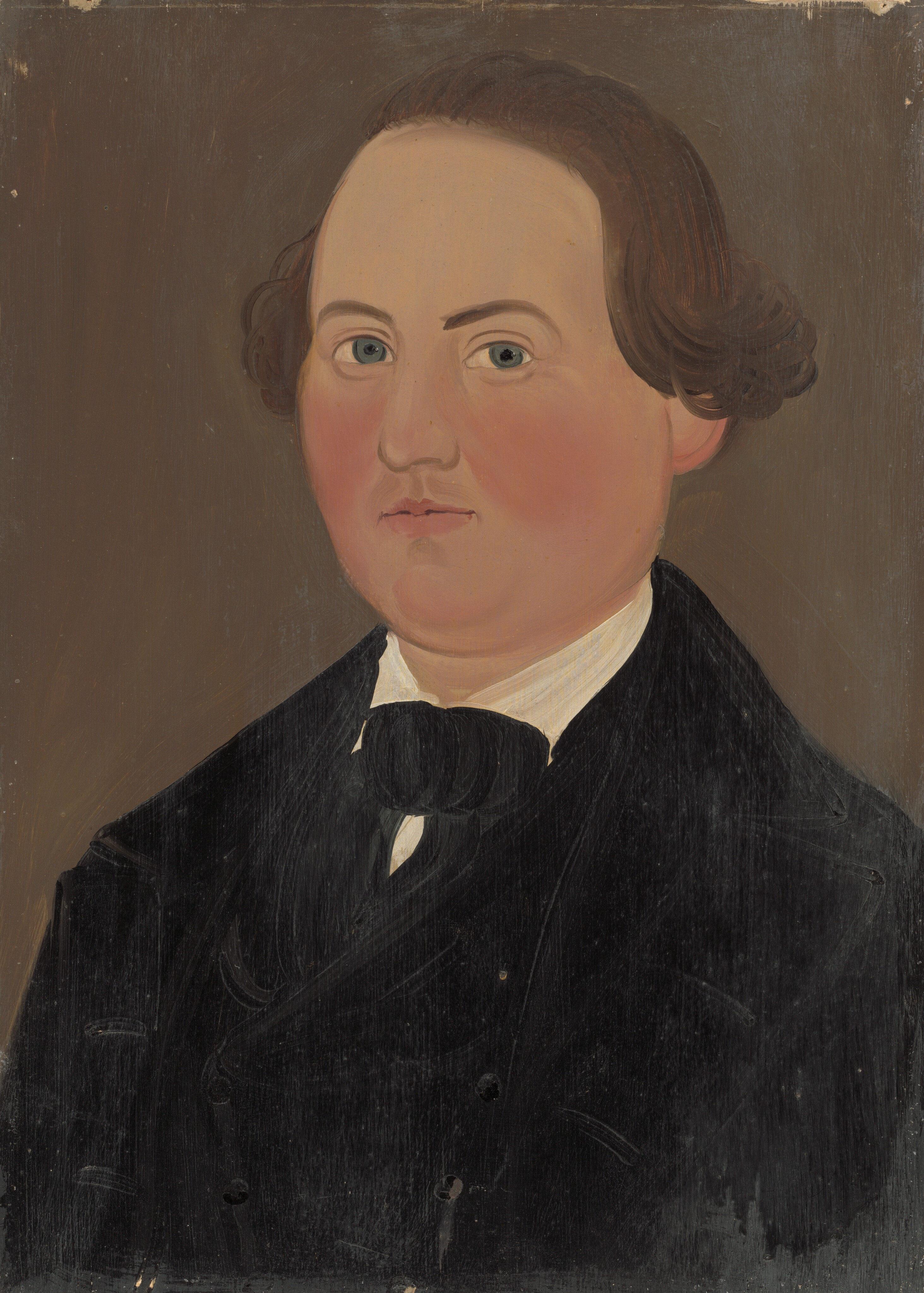 The image depicts the upper body of a person seated upright. Their face is turned towards the viewer, showing fair skin, rounded facial features, light-colored eyes, fine eyebrows, full lips, and brown, curly hair styled back. The person is wearing a dark jacket, waistcoat, white shirt, and a black cravat. The background is a plain, muted brown color.