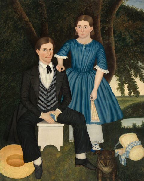 The image depicts a man and a young girl in a full-body portrait. The man is seated on a white bench, while the girl stands beside him with her hand on his shoulder. Both have fair skin and brown hair. The man wears a black suit with a white shirt, a black tie, and a patterned vest. The girl wears a blue dress with white lace trim and a white petticoat. A straw hat and a book are near the man, and a small brown dog and a white bonnet with blue ribbons are on the grass. Lush green trees and a body of water are in the background.
