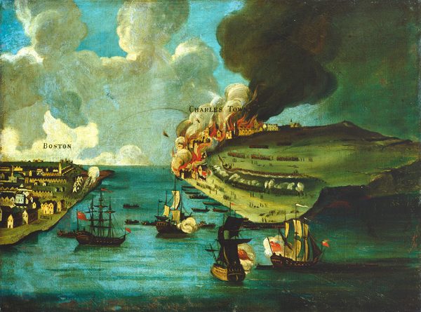 We look across and down at a channel of water separating two landmasses labeled "Boston" and "Charles Town" in this horizontal landscape painting. Four three-masted ships are in the aquamarine-blue harbor between us and the land. Three of them have their sails unfurled and smoke billows from the broad, starboard side of each. Tidy rows of brown houses line the area of Boston. A puff of white smoke rises from the farthest point. Two arrow-shaped missiles, perhaps projectiles on fire, arc toward Charles Town, where billowing gray plumes of smoke rise from vivid orange fire on the far side of the landmass. Rowboats bring soldiers to the shore of Charles Town, close to where hundreds of soldiers line up and fire at each other. Much of the rest of Charles Town is a hill leading to sheer cliffs to our right. Tan and gray-colored smoke mixes among bright white clouds against a pale blue sky on the top half of the painting.
