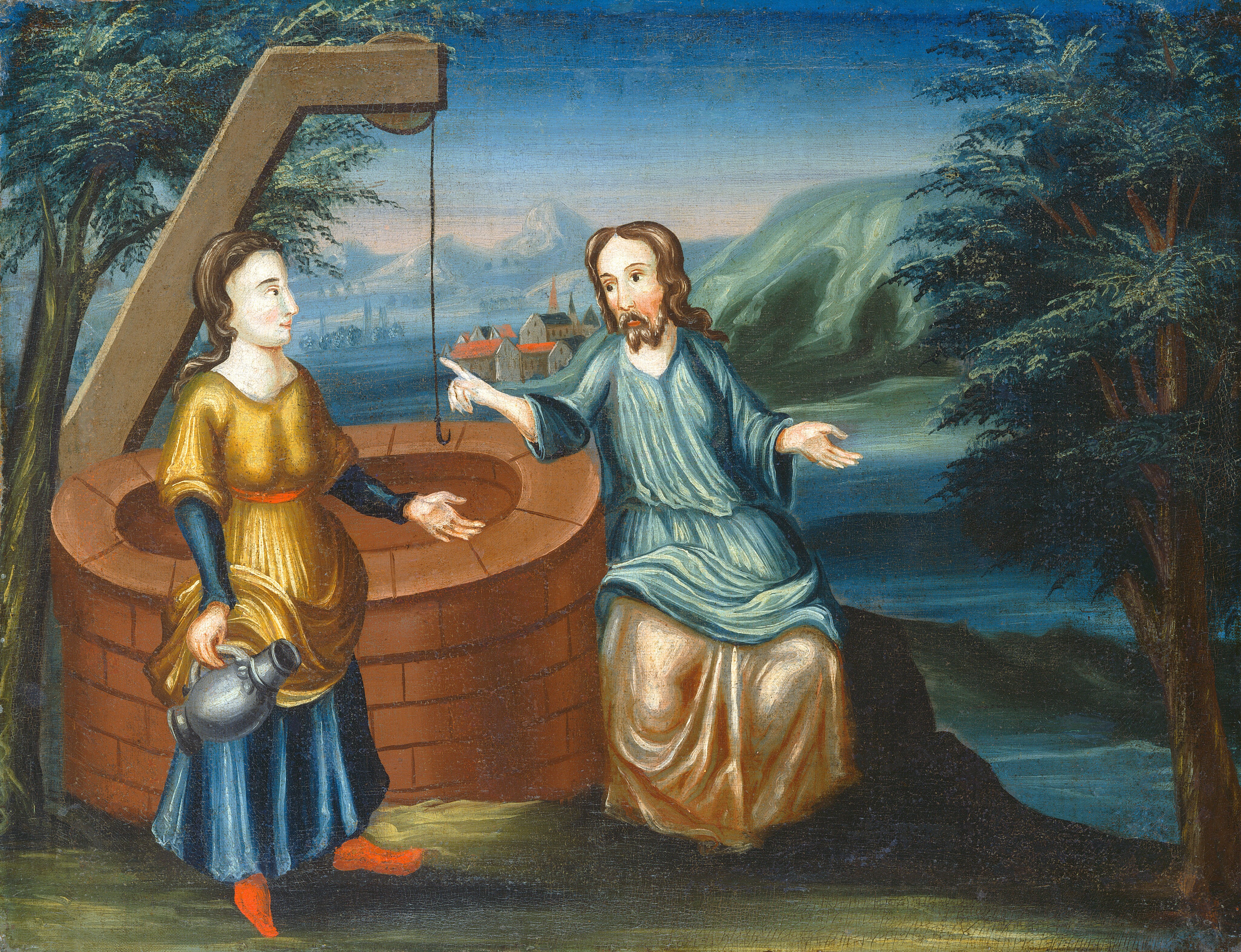 The image shows two individuals near a well. One person is standing holding a pitcher in her right hand, while the other is seated on the well's edge. The standing woman has fair skin, a round face, long dark hair tied back, and is wearing a golden yellow dress with a blue underskirt and red shoes. The seated person has long dark hair, a beard, and is wearing a light blue robe. Above the well, there is a pulley with a rope. In the background, there are trees on either side, and in the distance, houses and rolling hills are visible under a blue sky with soft brushstrokes indicating distant clouds.