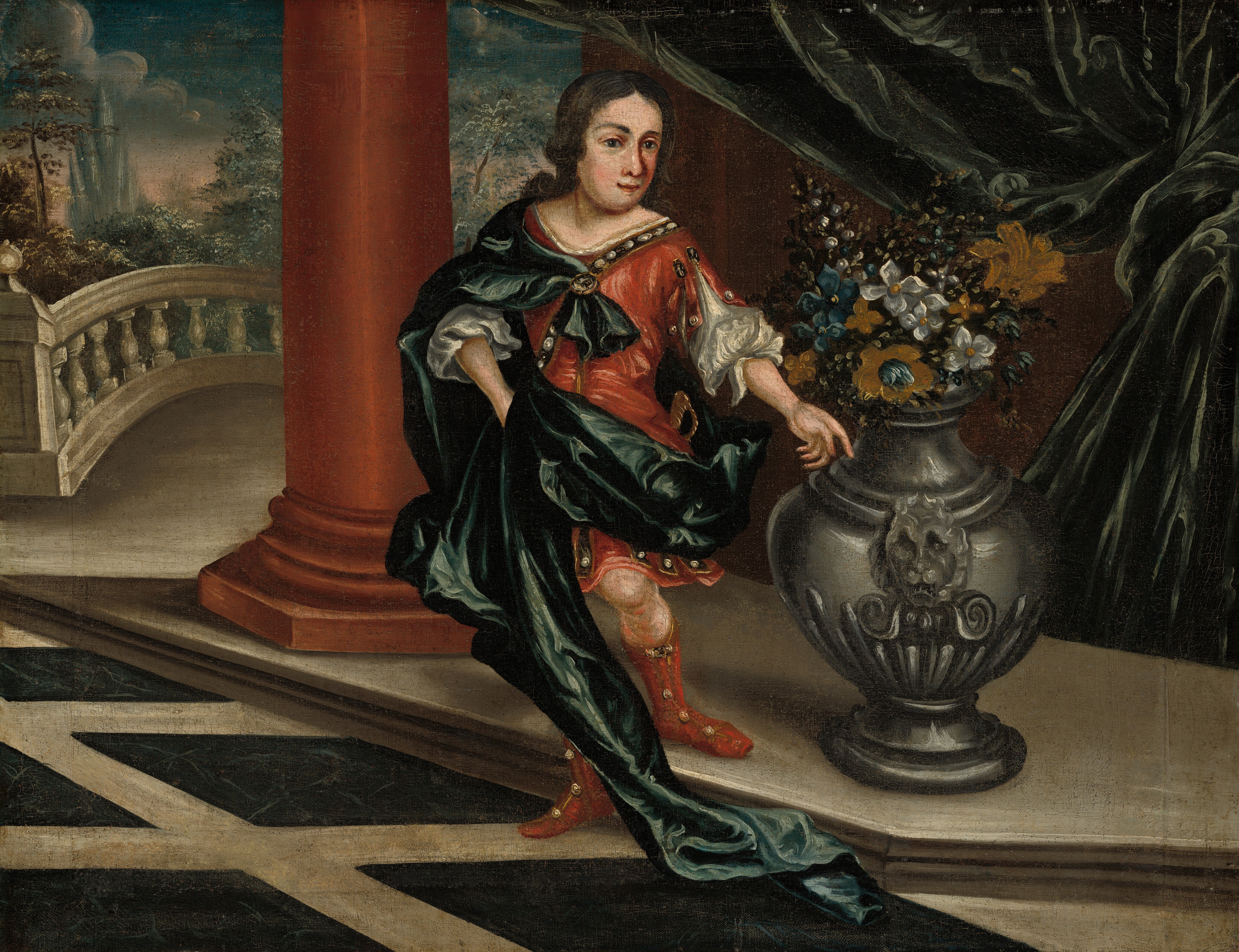 The image displays a young person standing next to a large, ornate vase filled with colorful flowers. The person has dark hair, rosy cheeks, and is wearing an elegant red outfit with a dark green cape. They have a large piece of jewelry on their chest and red footwear. The background features architectural elements and a large, flowing green drapery.