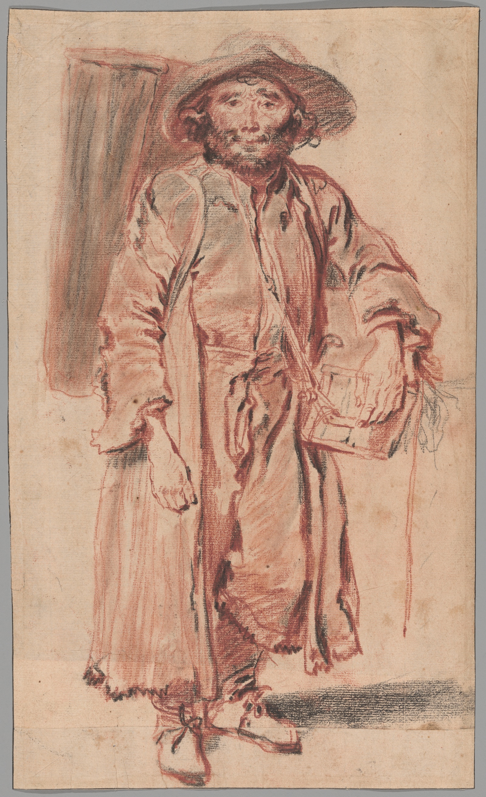Chalk drawing with red and black shading of man carrying crate and pack.