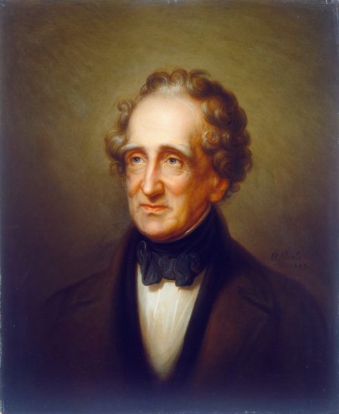 The image is a portrait of an older man, shown from the chest up. He has a fair complexion with prominent cheekbones, a slender nose, and expressive eyes. His light brown and gray hair is wavy with volume, slightly receding. He wears a dark brown coat over a white shirt with a high collar and a black cravat or bow tie. There are no visible accessories. The background is a muted brown. The painting is signed by the artist "R. Peale" and dated 1859.