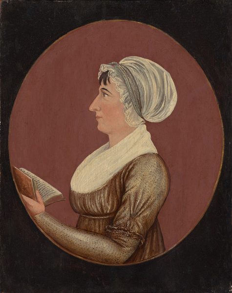 The image shows a woman in profile from the waist up. She has distinct facial features, dark hair with a white bonnet, and is wearing a brown dress with a white fichu. She is holding an open book in her left hand. The background is a plain, muted red oval area within a darker rectangle.