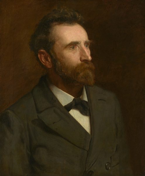This painting shows a man from the chest up, positioned facing the right, gazing into the distance. The male has pale skin, a long nose, and deep-set eyes. He has dark, wavy hair, a pointed beard, and a mustache that hides his mouth. He is dressed in a dark green jacket with notched lapels, a white shirt, and a dark bow tie. The background is uniformly painted in a muted, warm brown tone.