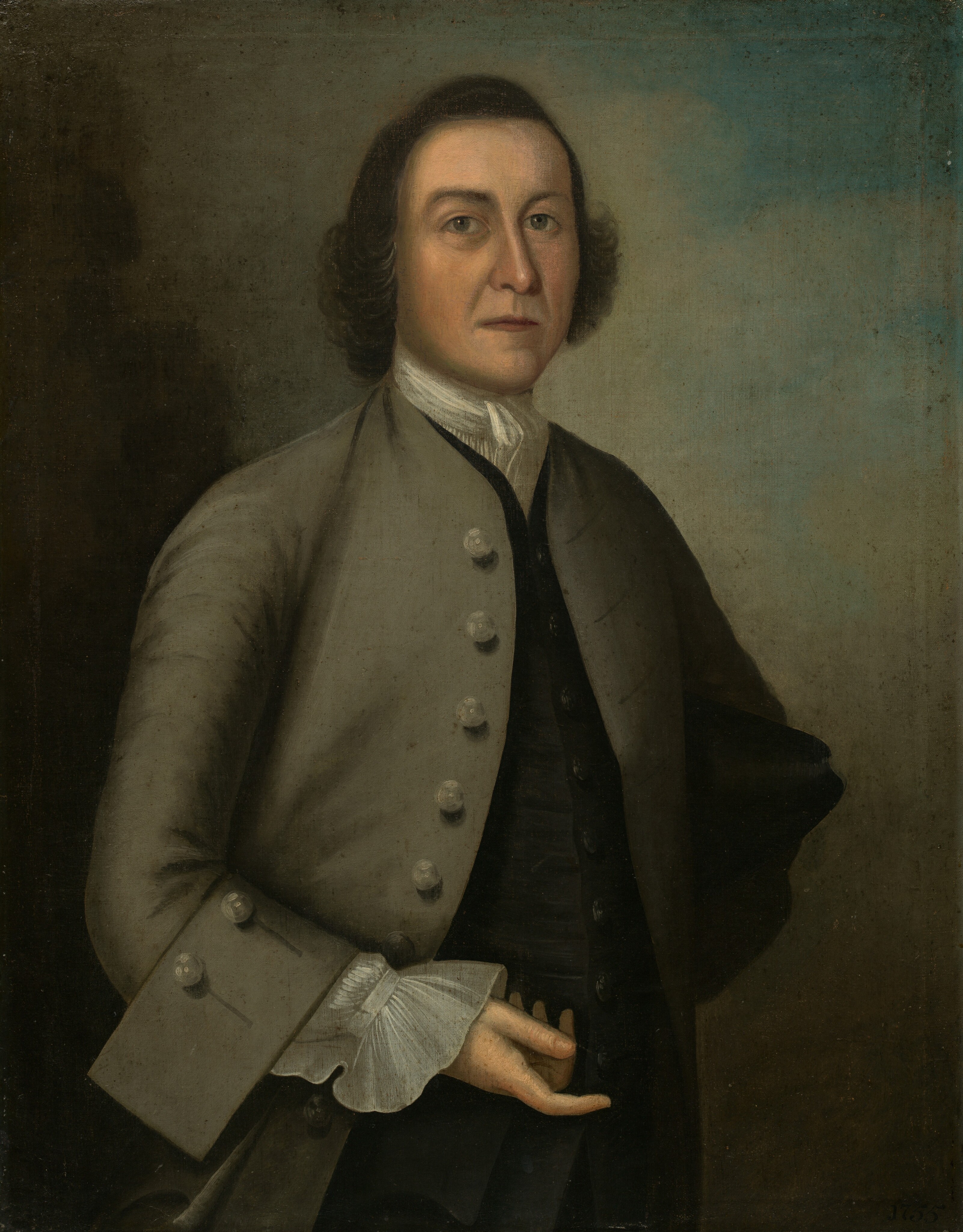 The image shows a man standing with his left arm bent across his waist. He has a serious expression, distinct facial features, brown hair, and is wearing an 18th-century outfit with a brown coat, white shirt, and ruffled cuff. His right hand is tucked into his coat. The background is plain with a gradient from dark brown to lighter shades.