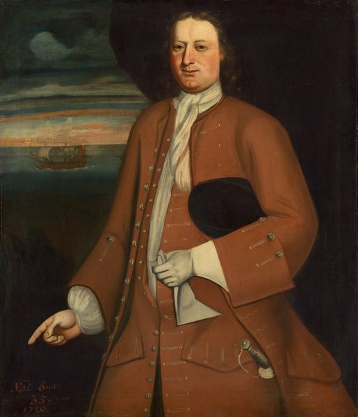 The painting depicts a man from the thighs up, standing and facing slightly to the left with his face turned towards us. His right hand appears to be pointing downwards towards the bottom-left corner. He has a broad face with fair skin, rosy cheeks, a long nose, and small eyes. His shoulder-length brown hair has a slight wave. The man wears a long rust-colored coat with silver buttons and a white cravat, along with a white shirt and cuffs at his wrists. His left hand wears a white glove, and he is holding the other glove in that hand. He also holds a black hat under his left arm and has a sword tied to his waist. The background is dark, with a cloudy sky visible on the left and a ship sailing on dark, calm waters.