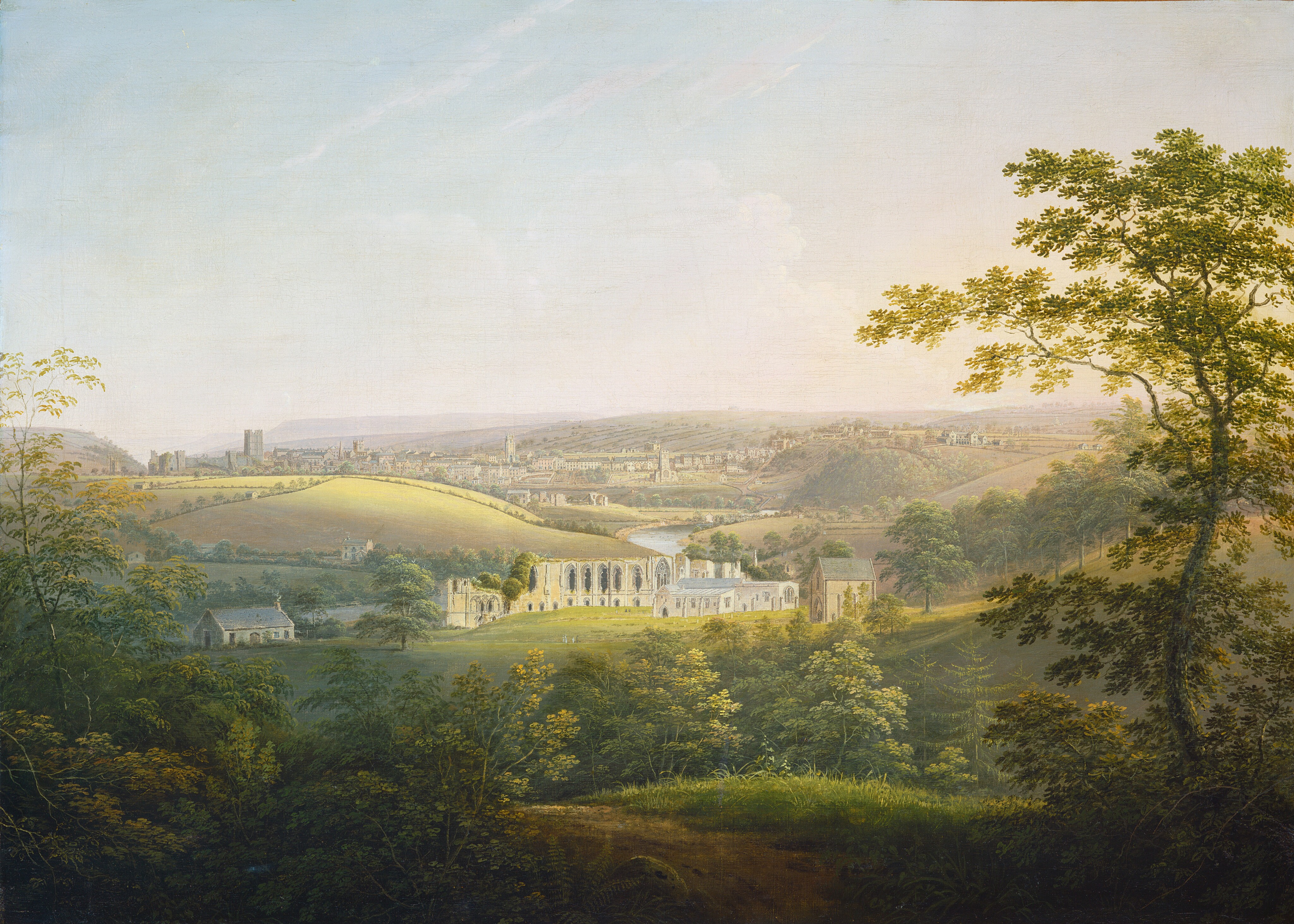This painting features an elevated view of a pastoral landscape with a white city nestled among rolling hills. The horizon is just above the center of the painting, with the scattered buildings and green hills stretching beneath a vast light blue sky. Lush trees and foliage frame the land closest to us, with leaves in various shades of green and what looks like a small brown path leading from the top of a hill down towards the land in the distance. In the center of the painting, an ornate white building with large windows stands in a sunny patch of land, while distant structures are scattered amidst hills and valleys. The color palette includes muted greens, soft yellows, earthy browns, cool blues, and whites.