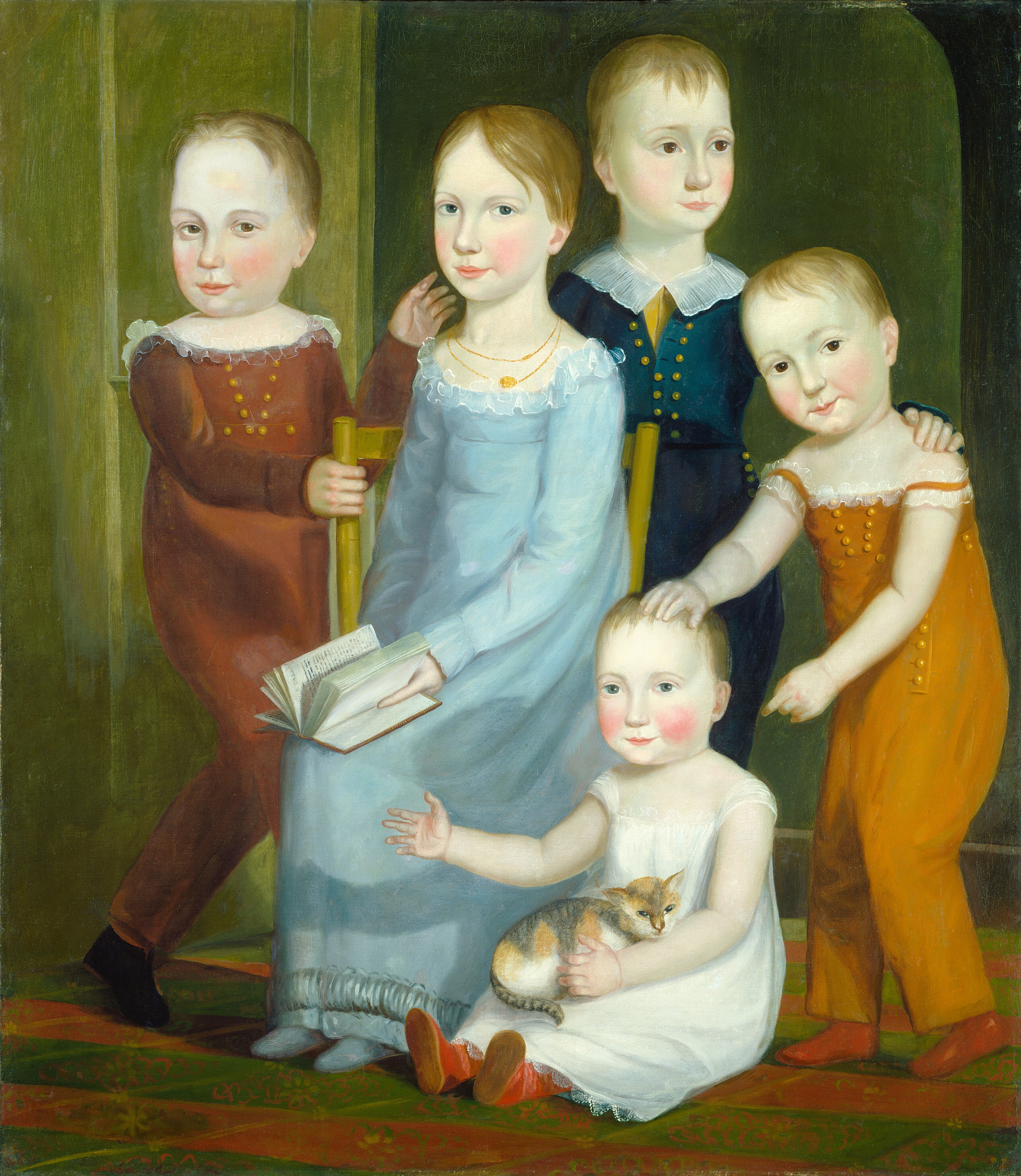 This painting shows five children in a room. All the children have pale skin, rosy cheeks, and short blond hair. In the center, one child is seated on a yellow chair holding an open book. This child is wearing a blue dress with two gold necklaces. On the left, another child in a red one-piece garment holds the edge of the chair. A third child stands behind the chair, wearing a blue one-piece garment over a yellow shirt. Their hand is on the shoulder of the fourth child, who stands on the right, wearing an orange one-piece garment. This child's hand is on the head of the fifth child, who sits by the chair. This child wears a white dress and holds a small cat in their lap. The cat's fur is a mix of white, gray, and orange. The children stand in front of a green background, with a patterned red-and-green carpet underfoot.